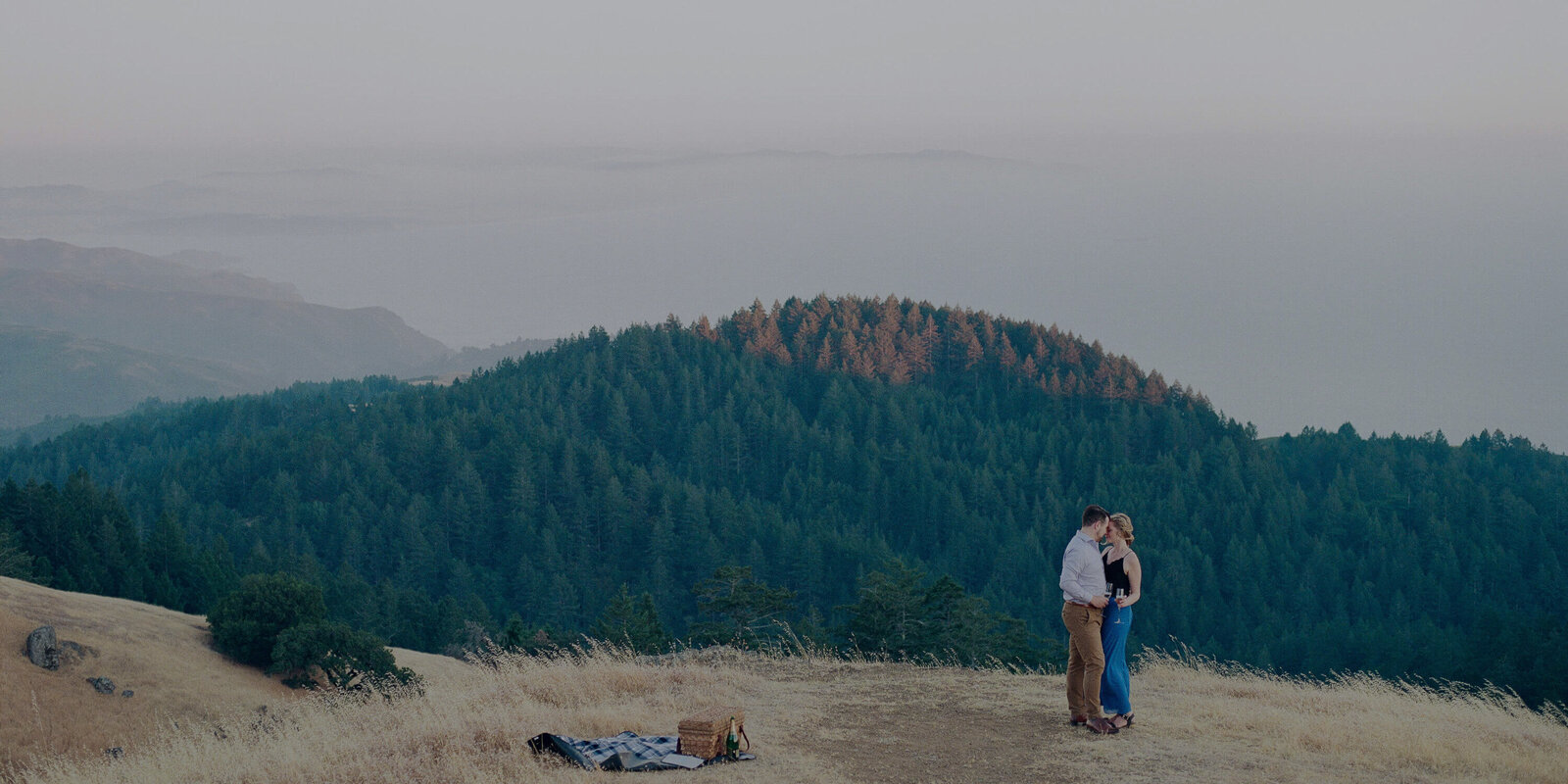 Oregon Elopement couple dancing on mountain top.