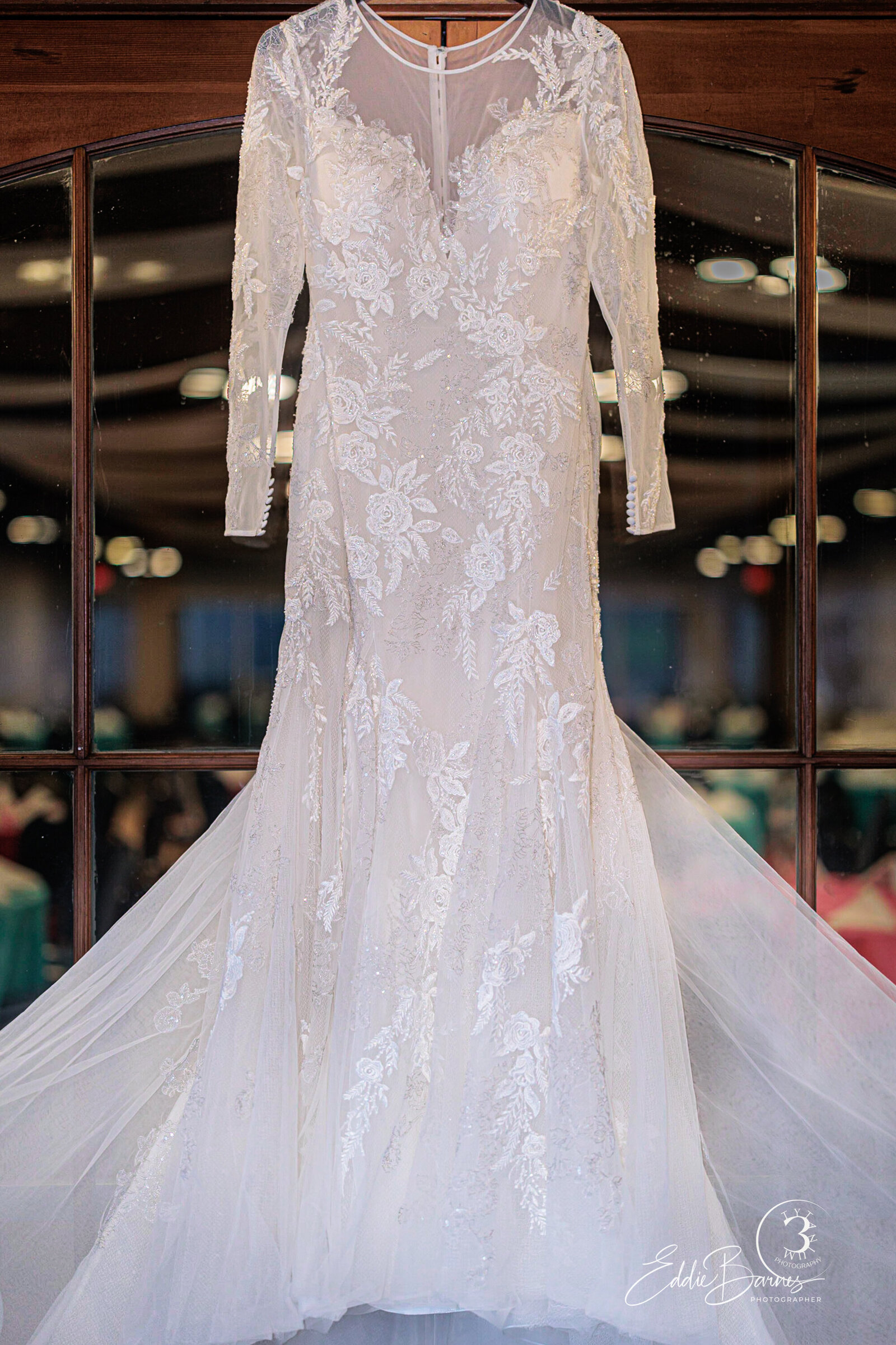 Wedding dress hanging on door