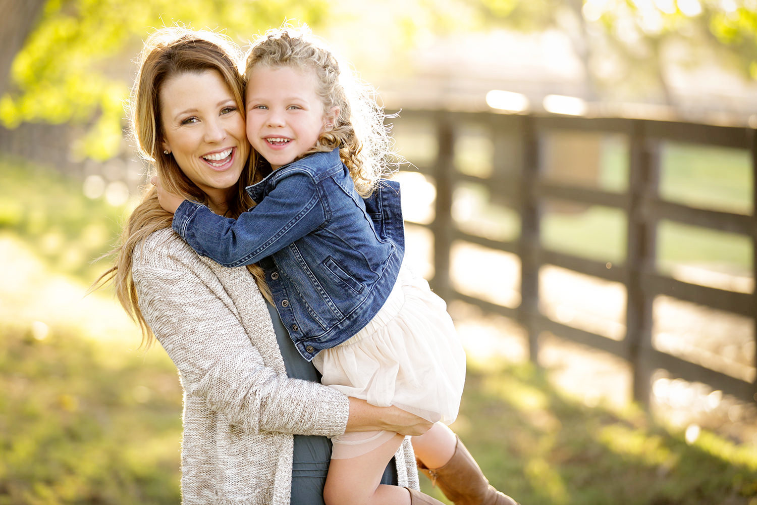 san diego family photography | mom and daughter with fence smiling