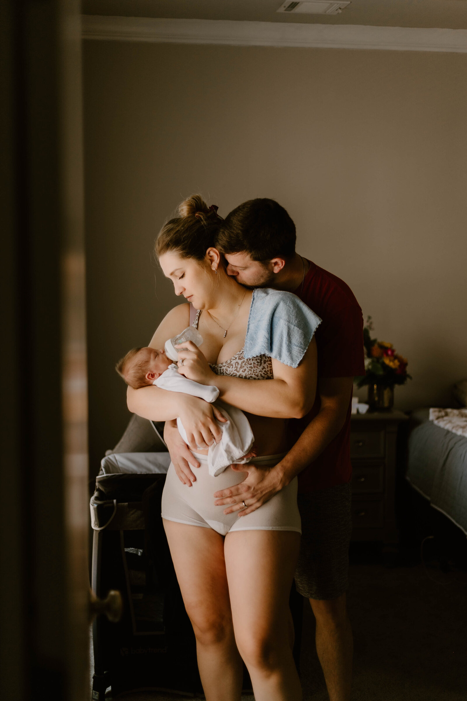 Parents enjoying time with their new baby. Raw, emotional photos by Sydnie Decou