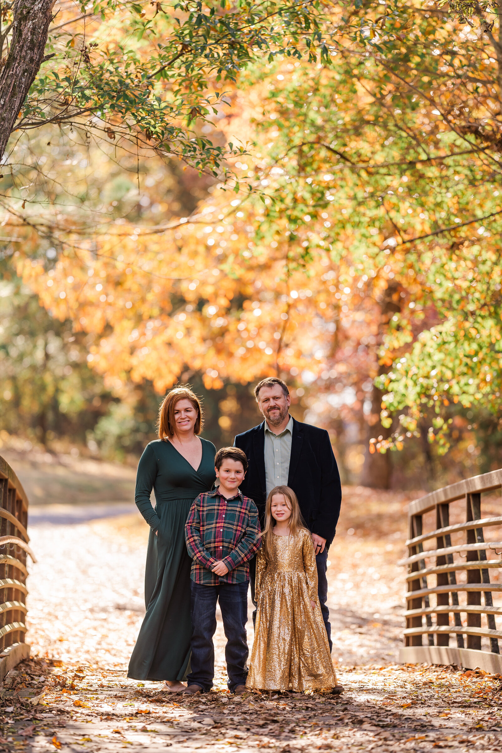Family poses for fall photo at Greenway Farms