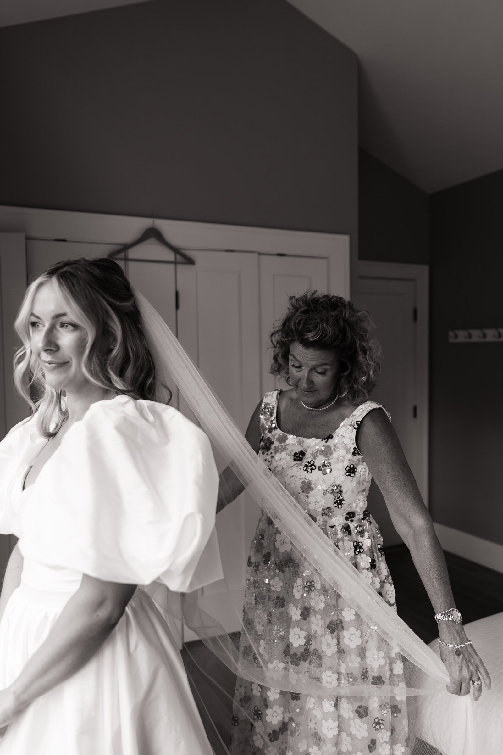 Bride getting ready with mom for wedding at TRICA Castle Cathedral in Boise