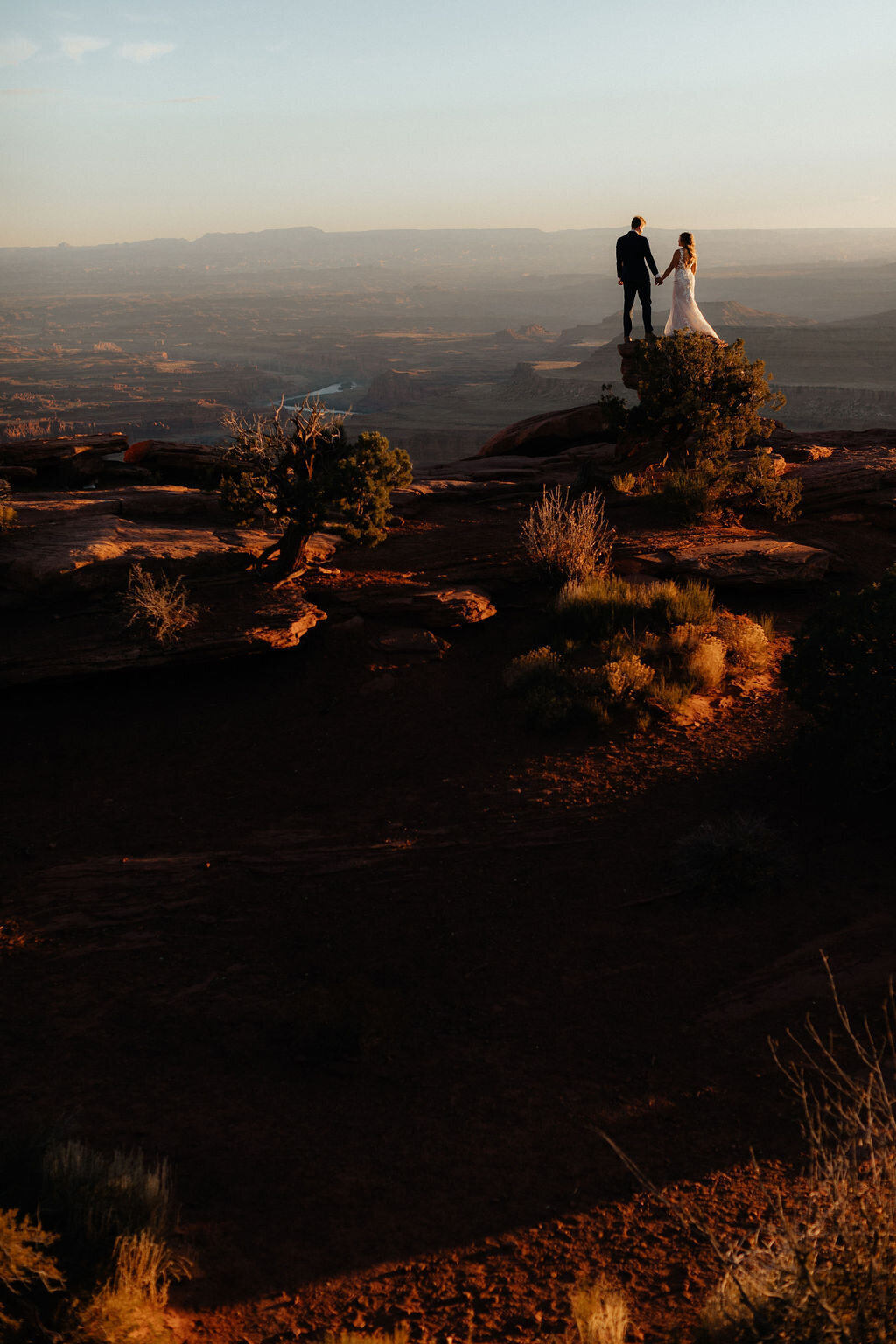 A couple exchanging vows in a remote Utah canyon, captured by a pro photographer