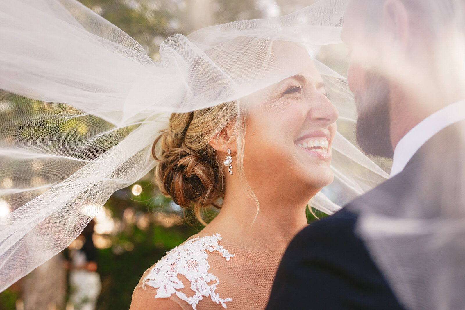 bride-smiling-under-veil-lisa-gilbert-photography