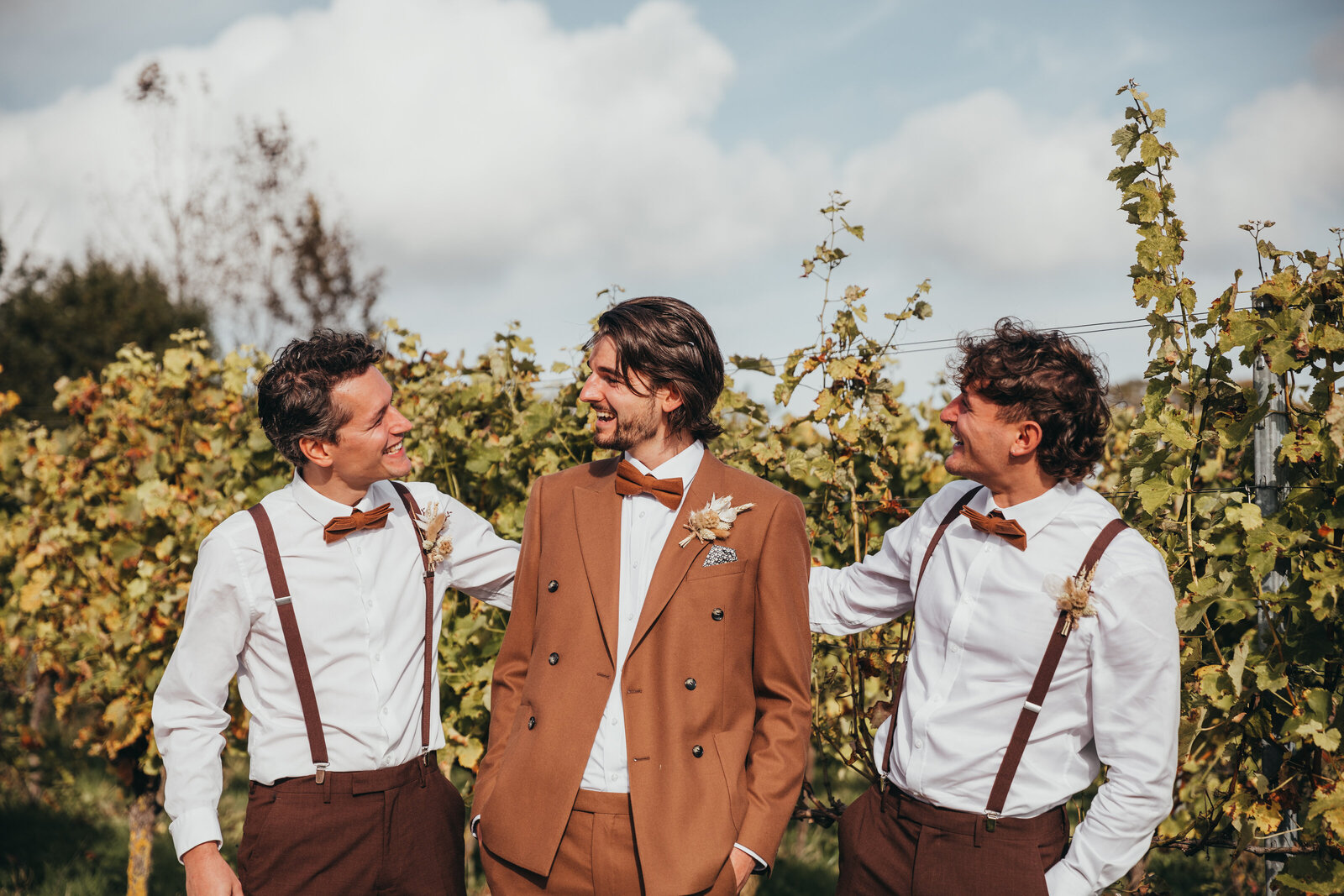 groom posing with groomsmen