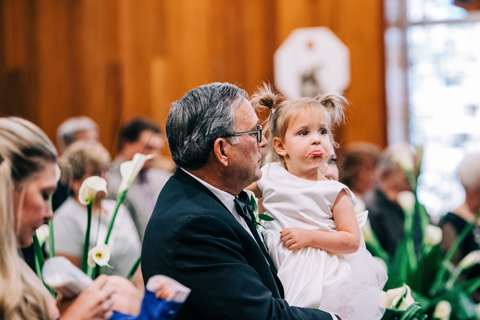 Capturing a real moment of a kid during a wedding ceremony