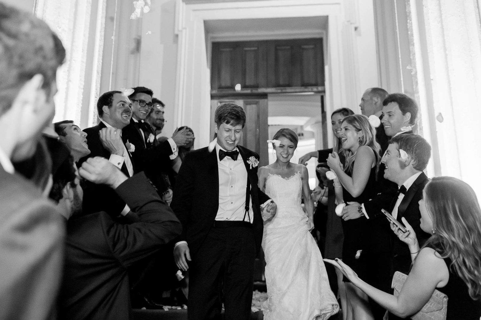 Bride and groom exit to their vintage Rolls Royce, Hibernian Hall, Charleston, South Carolina