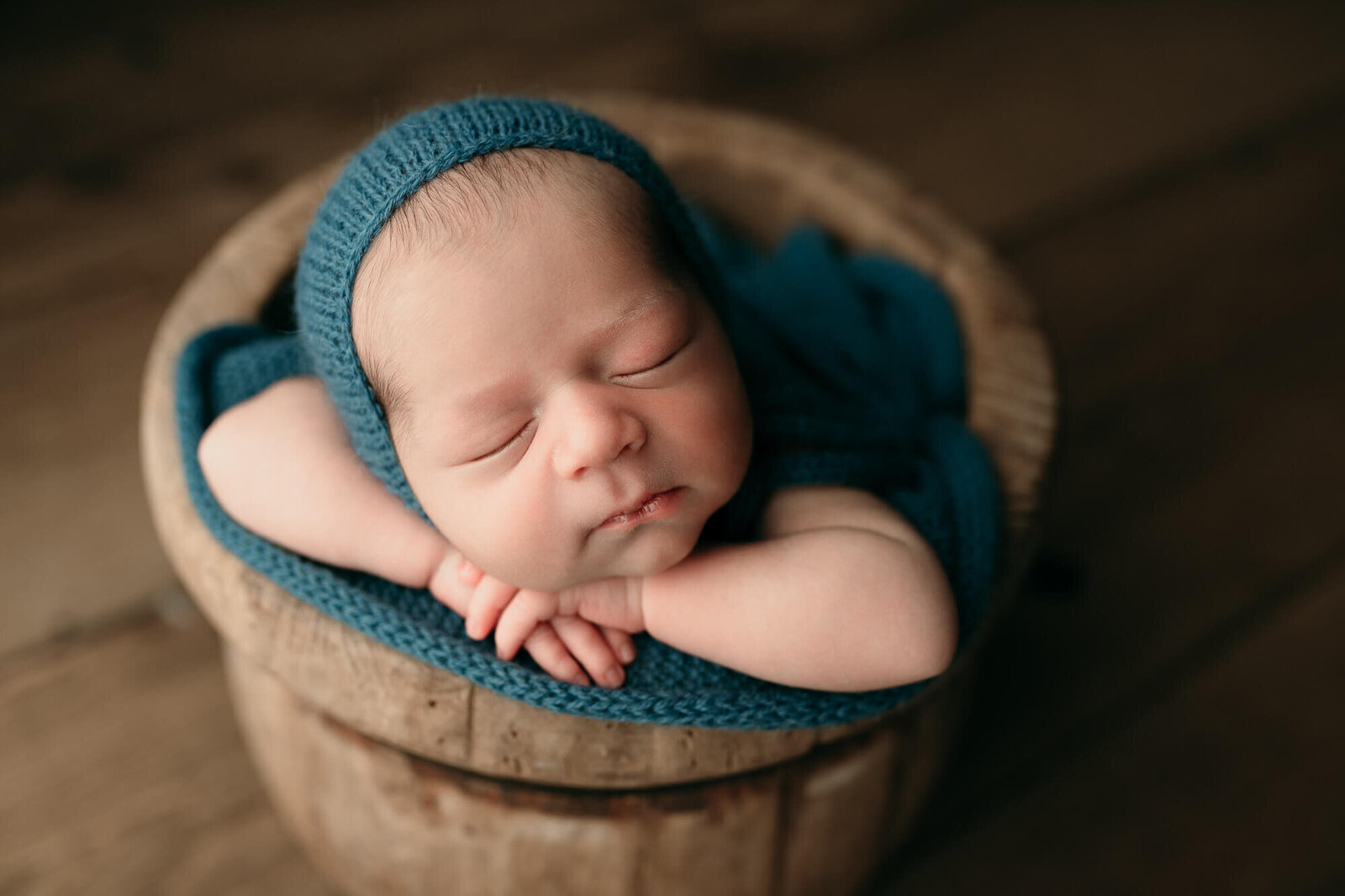 baby in a bucket