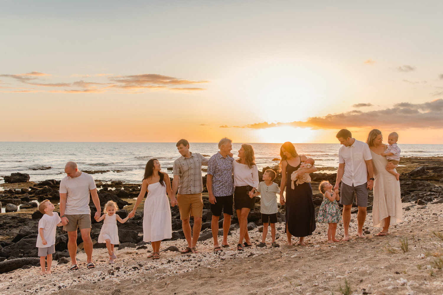 extended family walking on beach