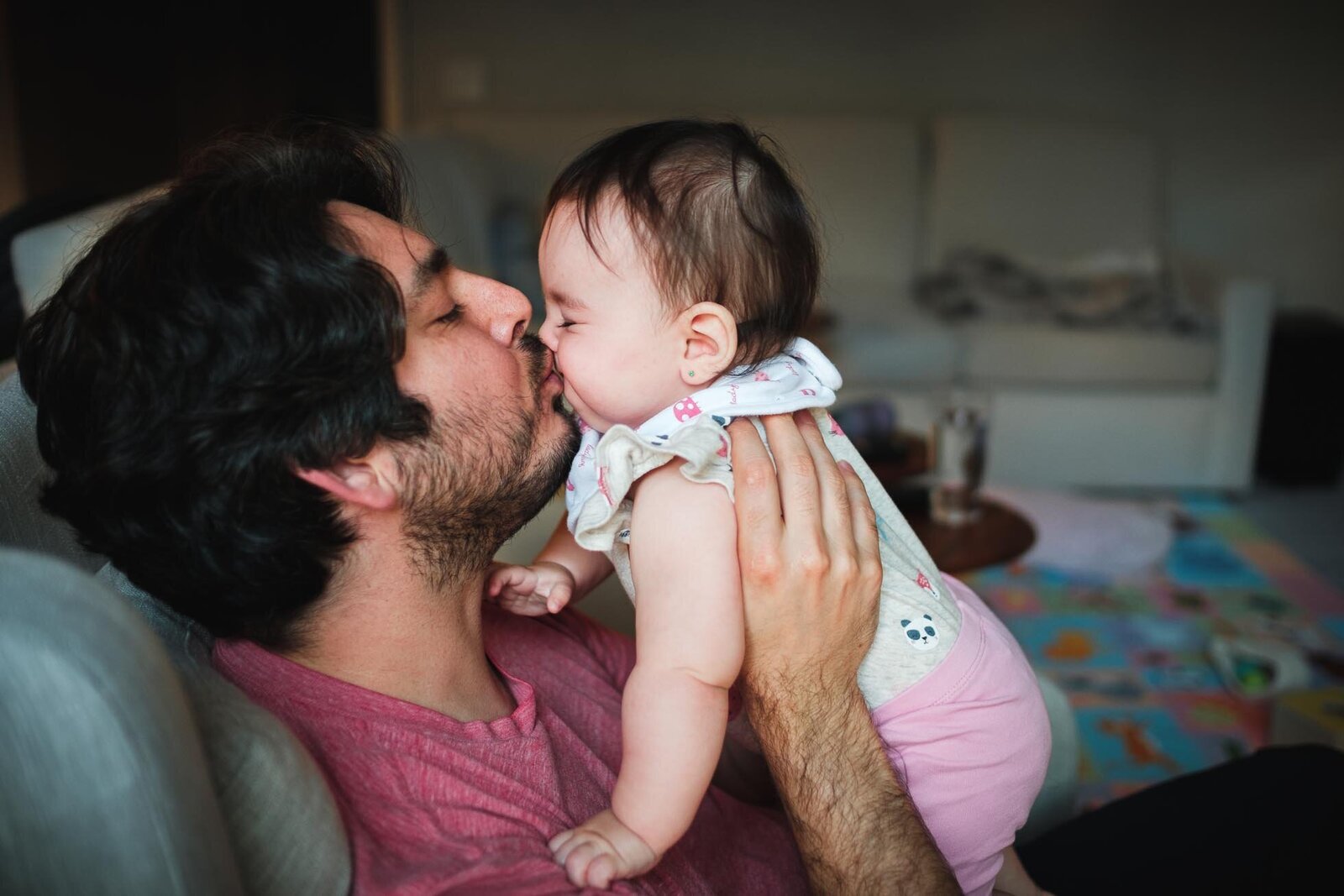 dad kisses his daughter