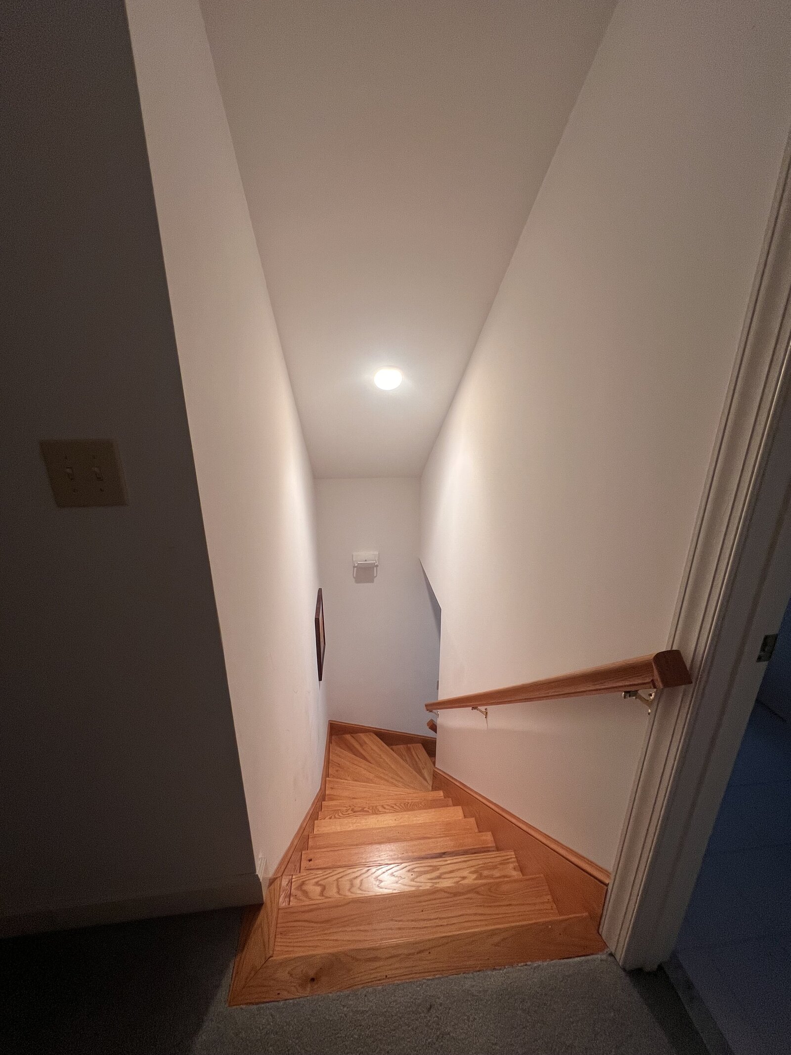 over garage apartment stairs to kitchen