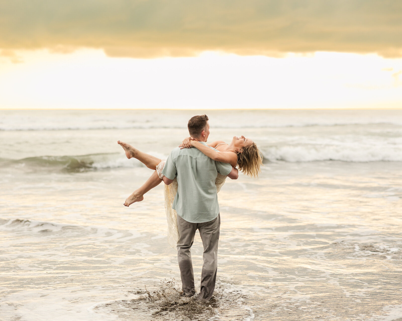 Man carries woman away into the ocean