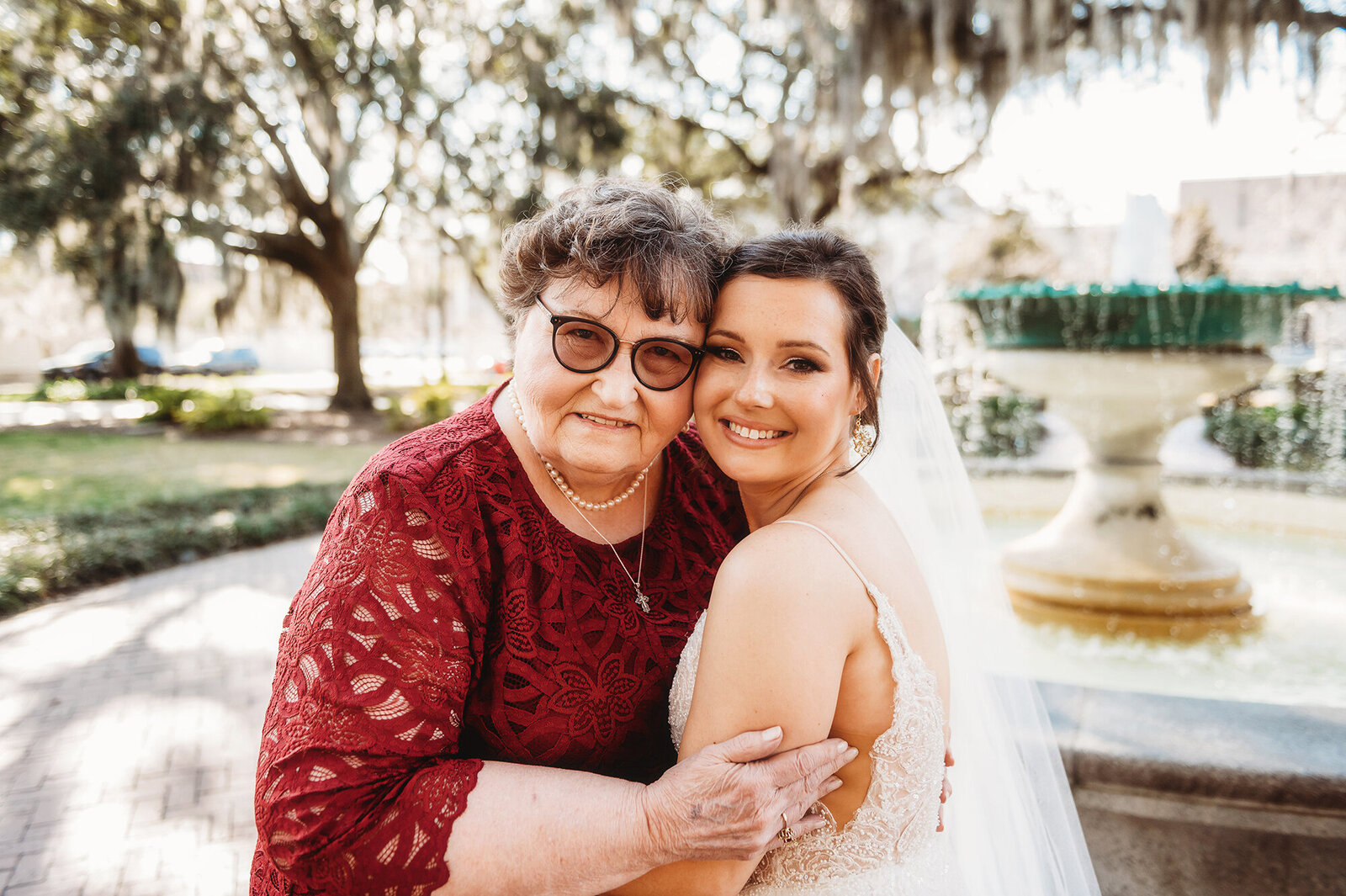 Bride hugs her grandmother during portraits before her Micro-Wedding in Savannah, Ga.