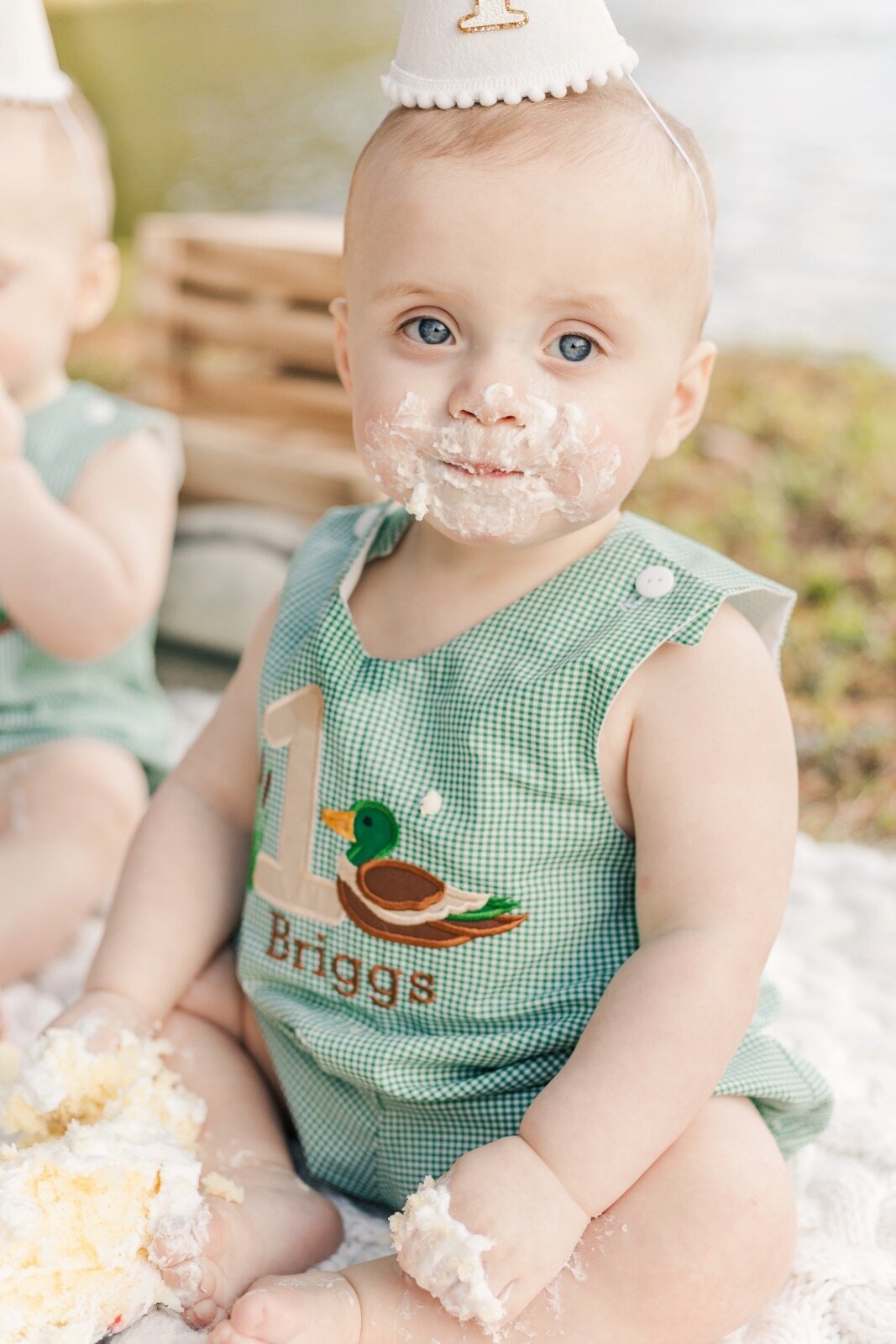 Baby with cake on his face