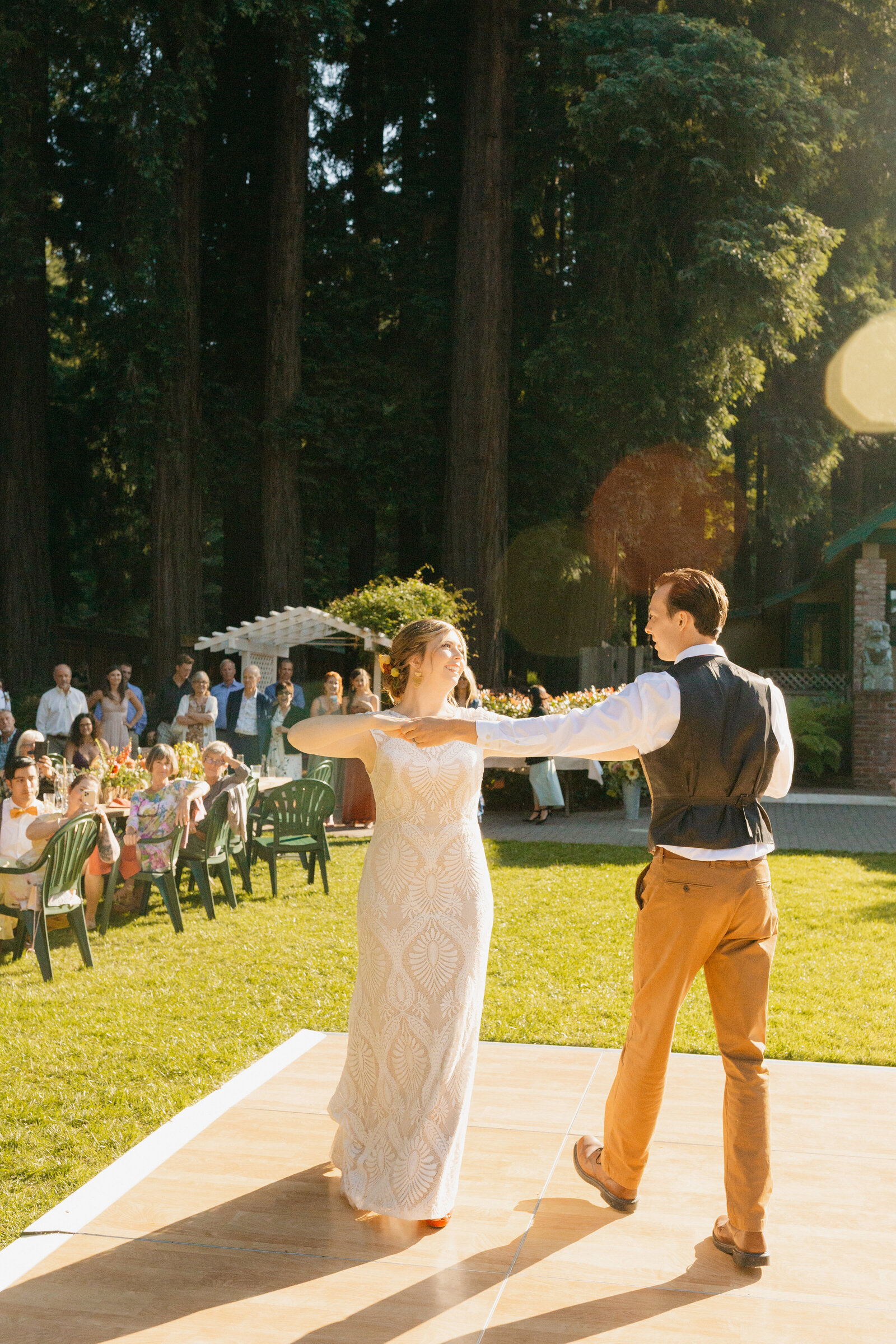 Bride and groom on their colorful wedding day in Santa Cruz, California in the redwood trees.