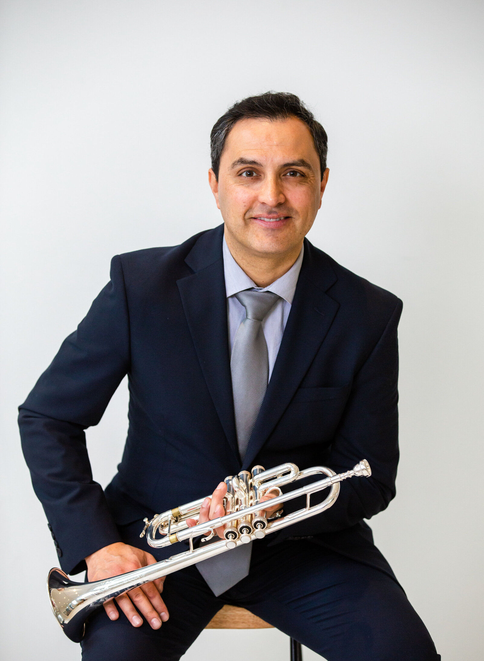 musician with trumpet branding