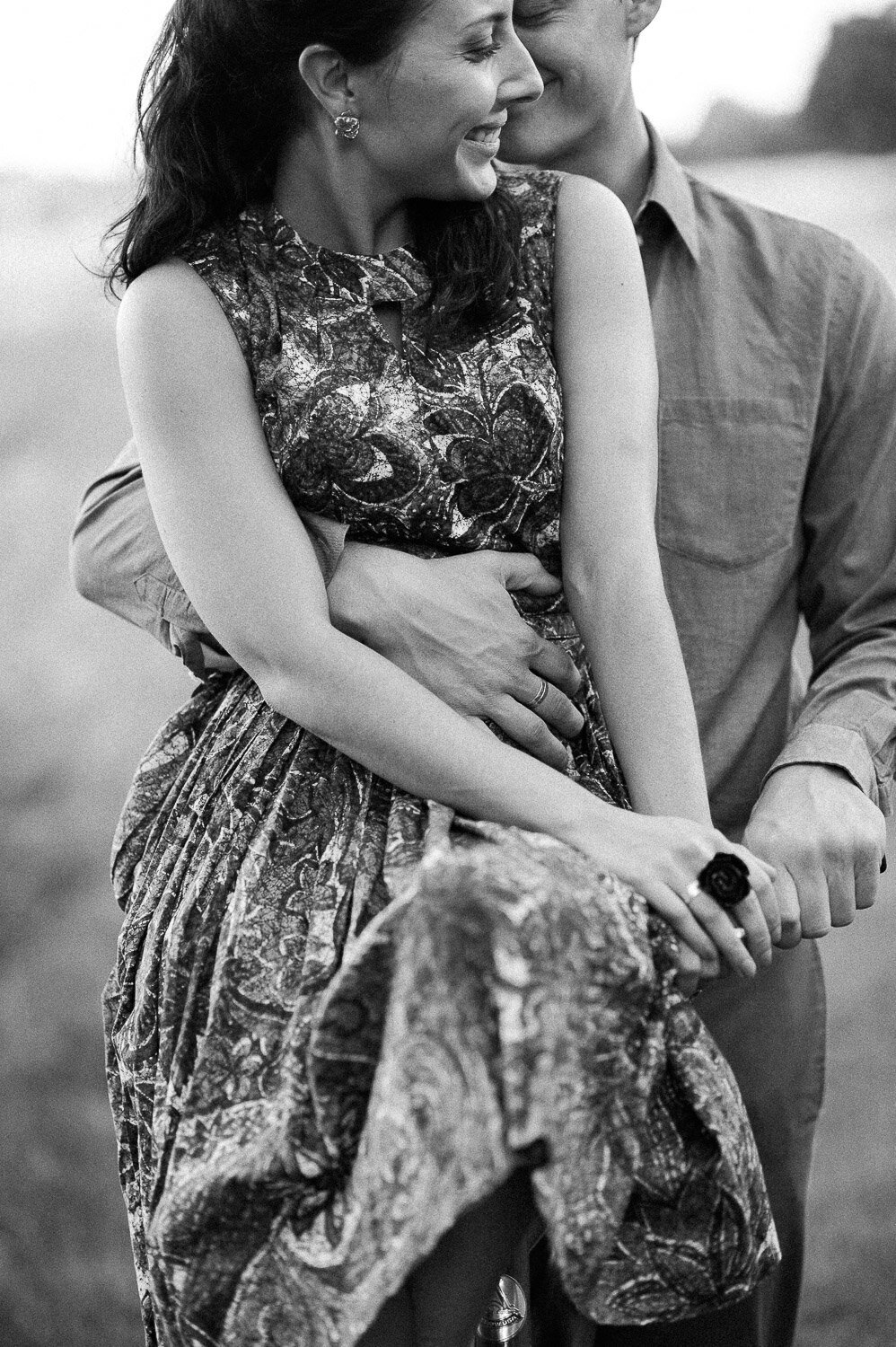 couple snuggle girl on bike