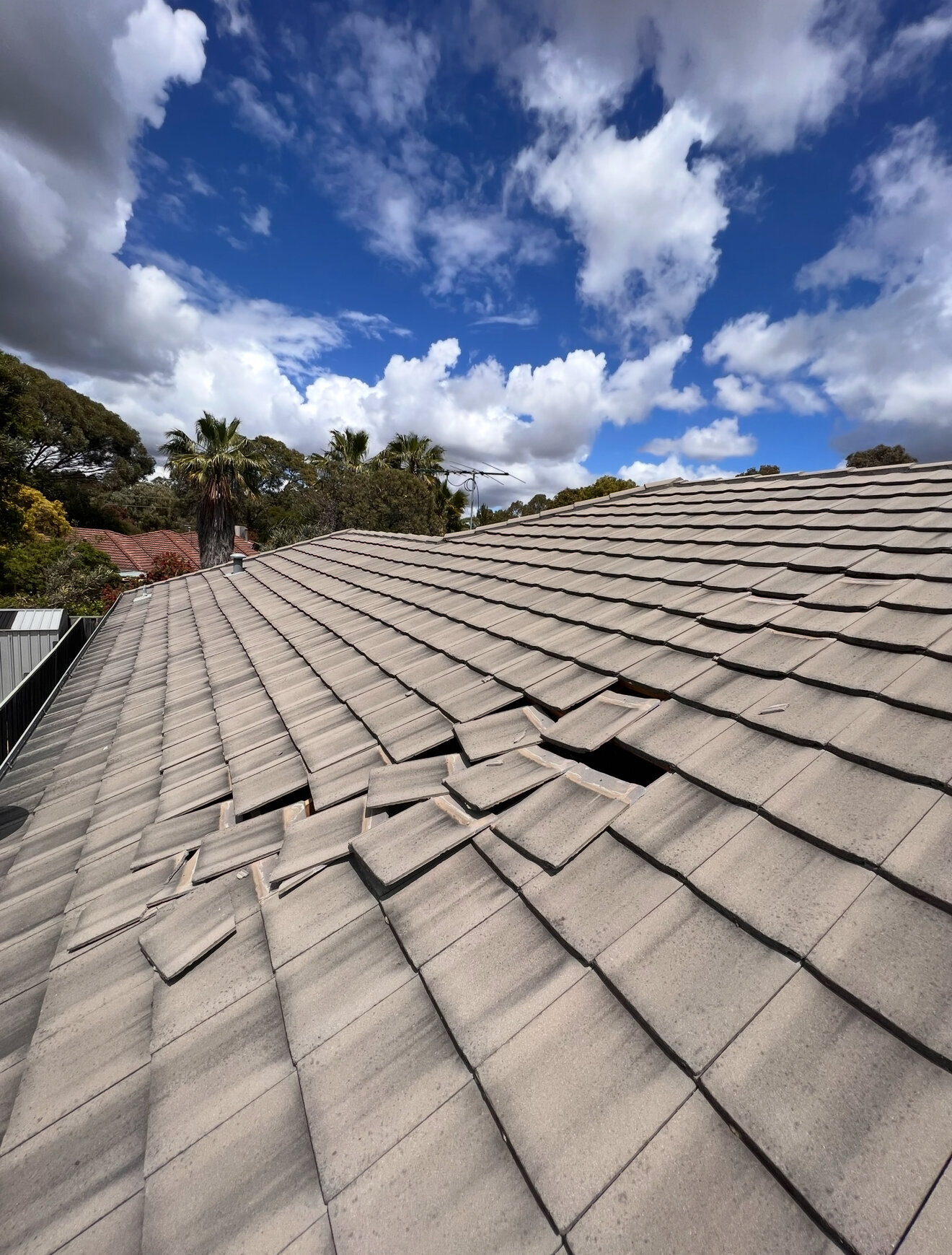 Roof inspection identifying loose tiles during building inspection by Captis Creations Perth