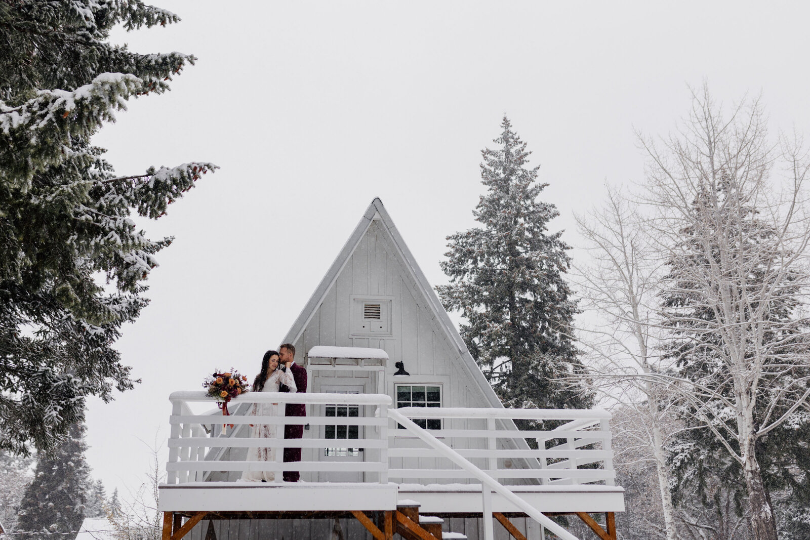 A magical winter elopement with a bride gracefully walking through a snowy Pacific Northwest forest, perfect for adventurous souls