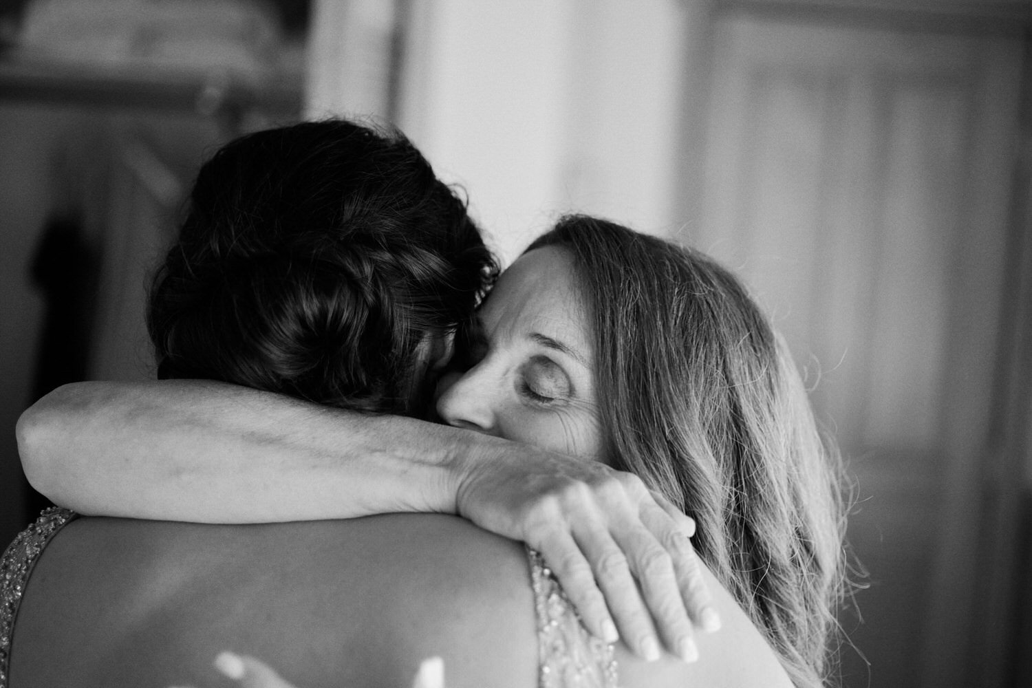 Bride hugs her future mother in law.