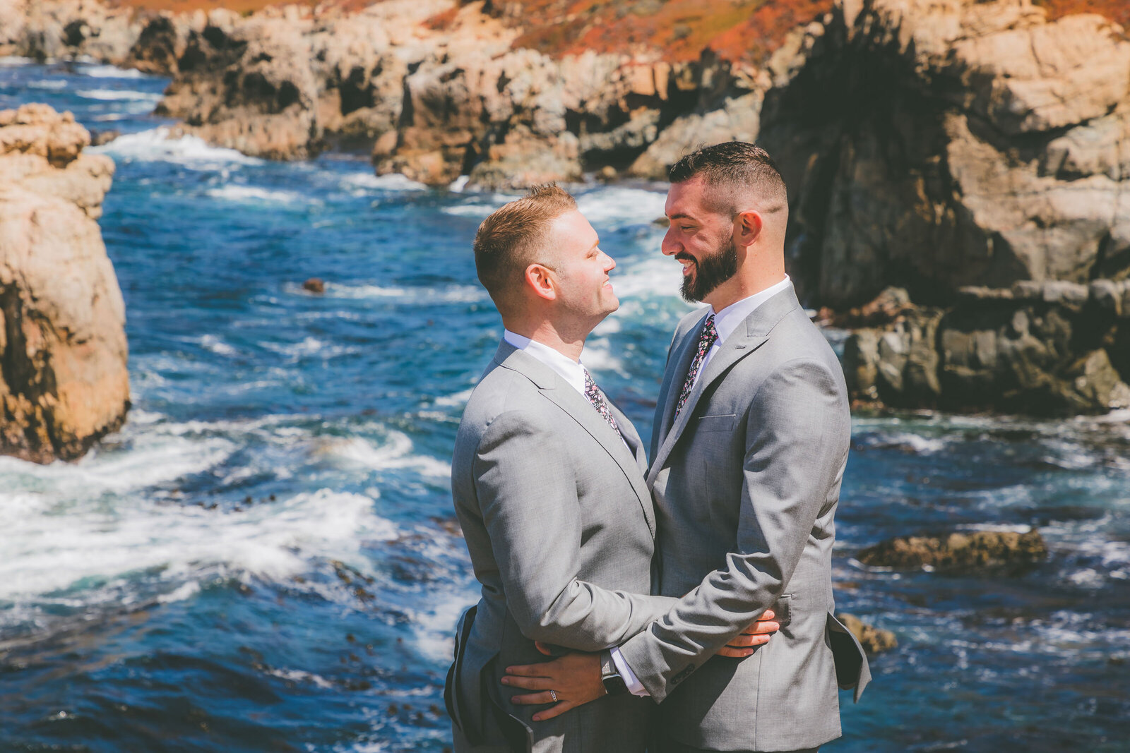 A gay couple looks into each other's eye during their Big Sur elopement.