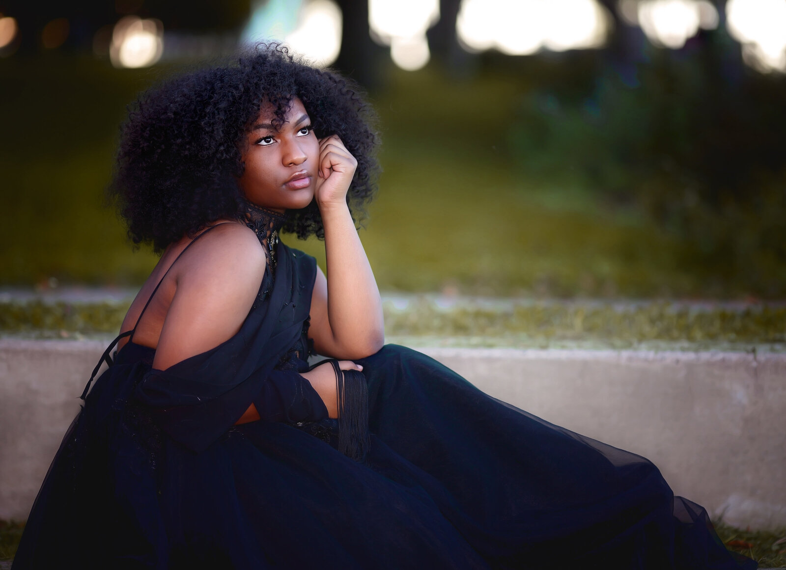 Savannah Boudoir Photography and Glamour showcases gorgeous black girl in designer gown looking away