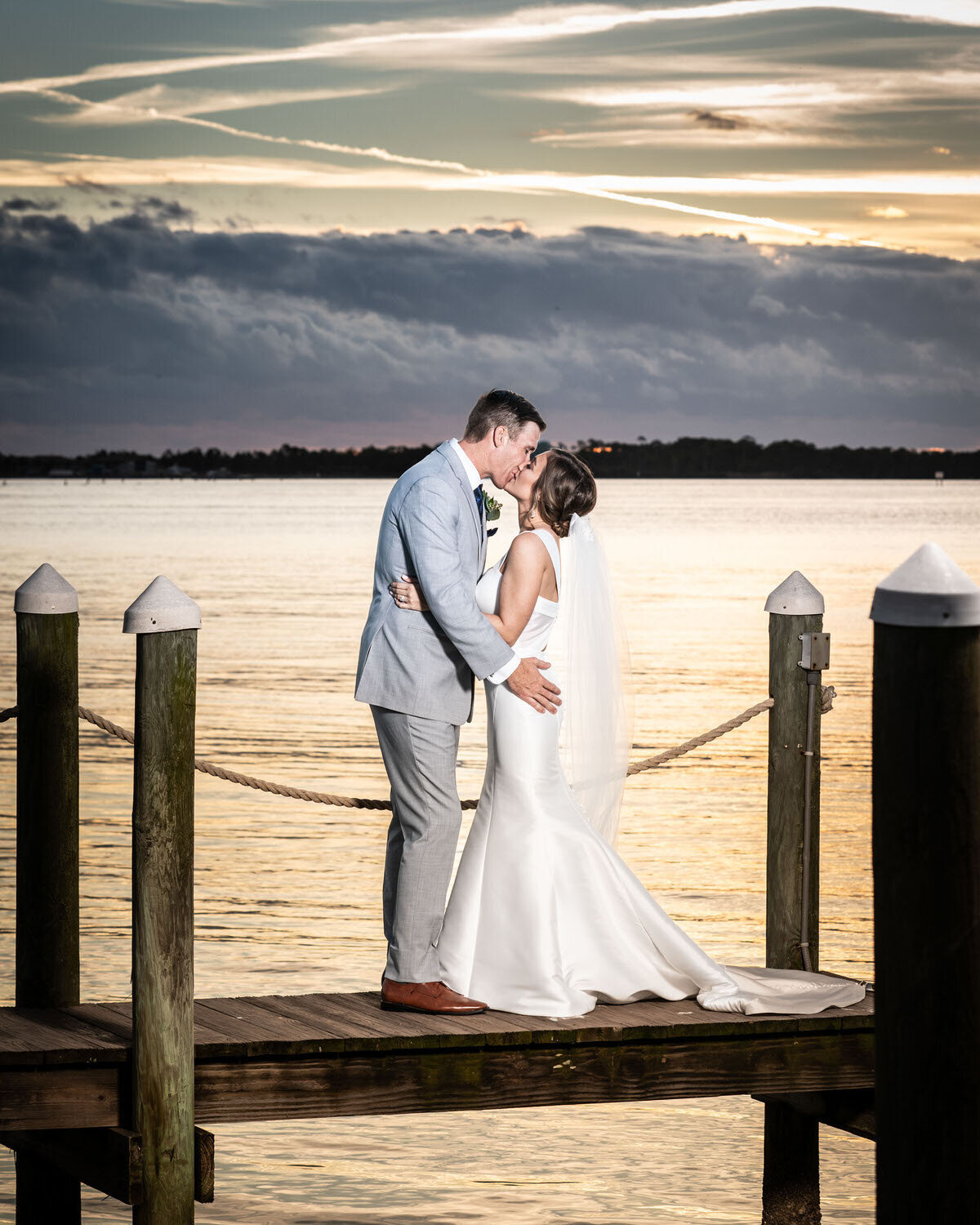 couple-on-dock-dramatic-sky-4x5