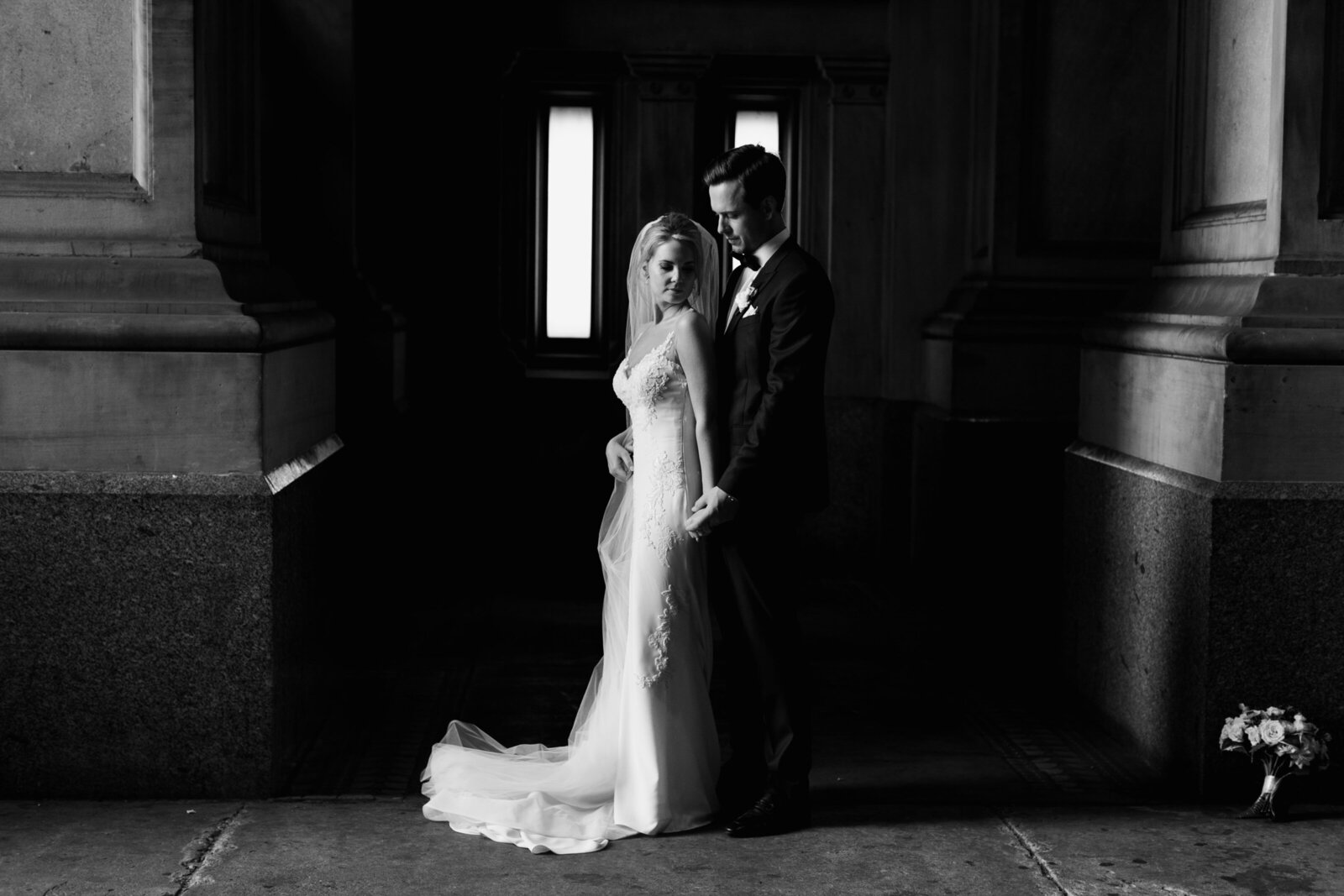 bride and groom underneath philadelphia city hall