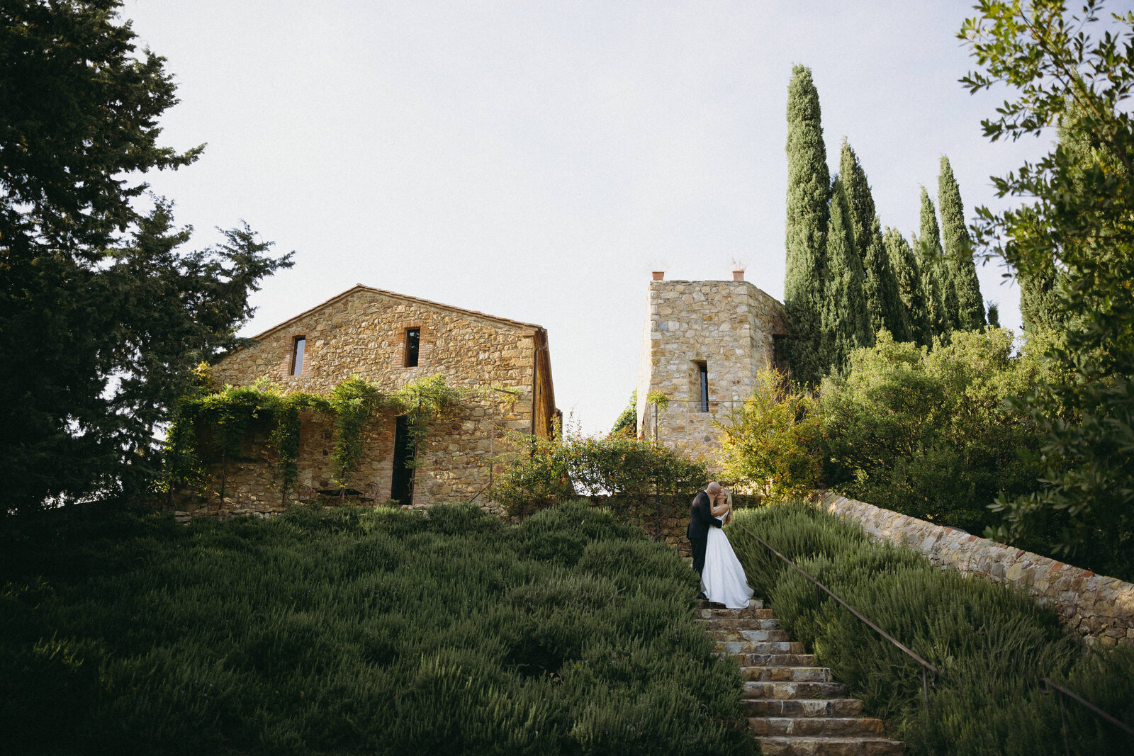 Couple celebrating their wedding day at Castello di Vicarello, surrounded by Tuscany’s beauty and history.