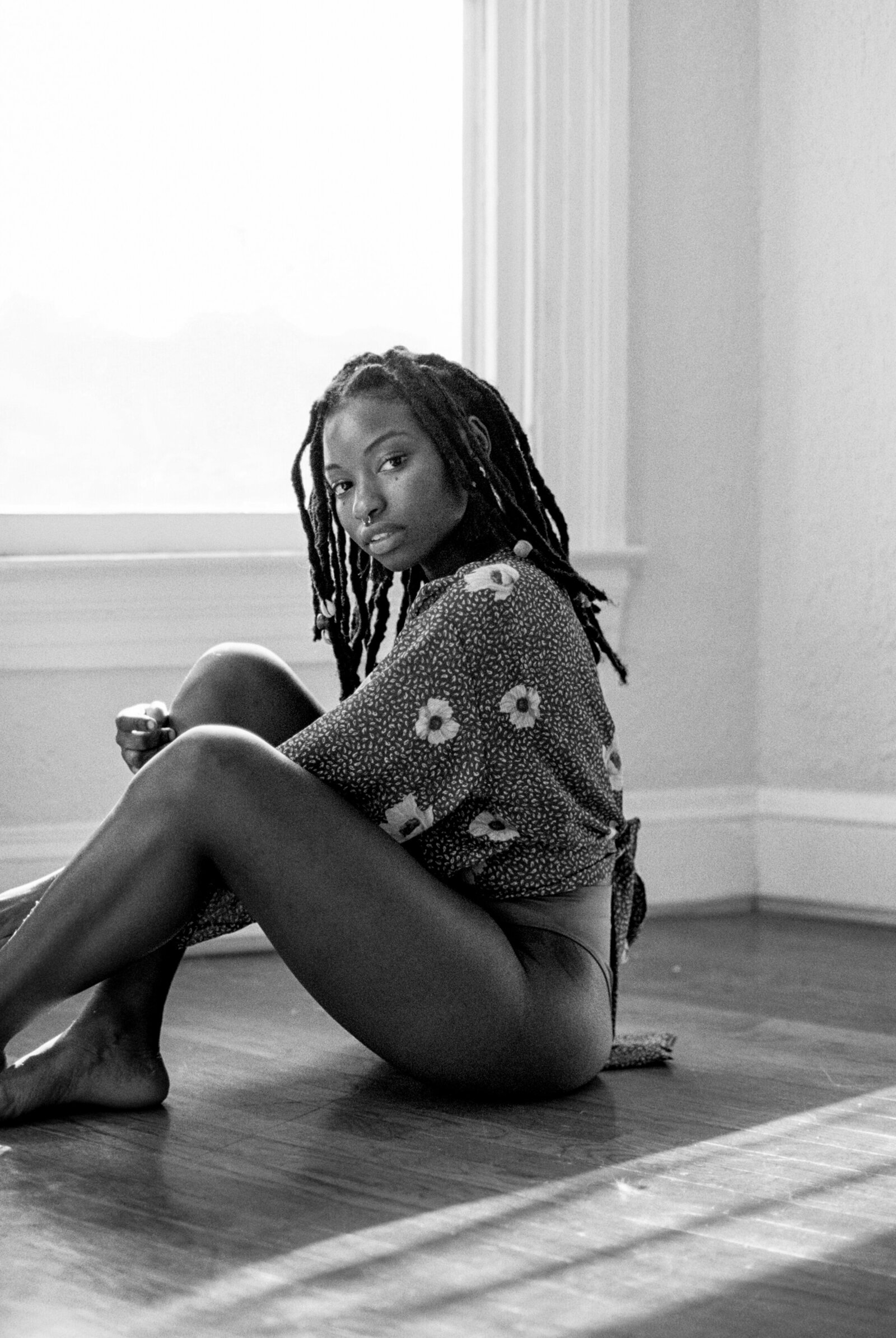Boudoir photo of a black woman wearing a thong