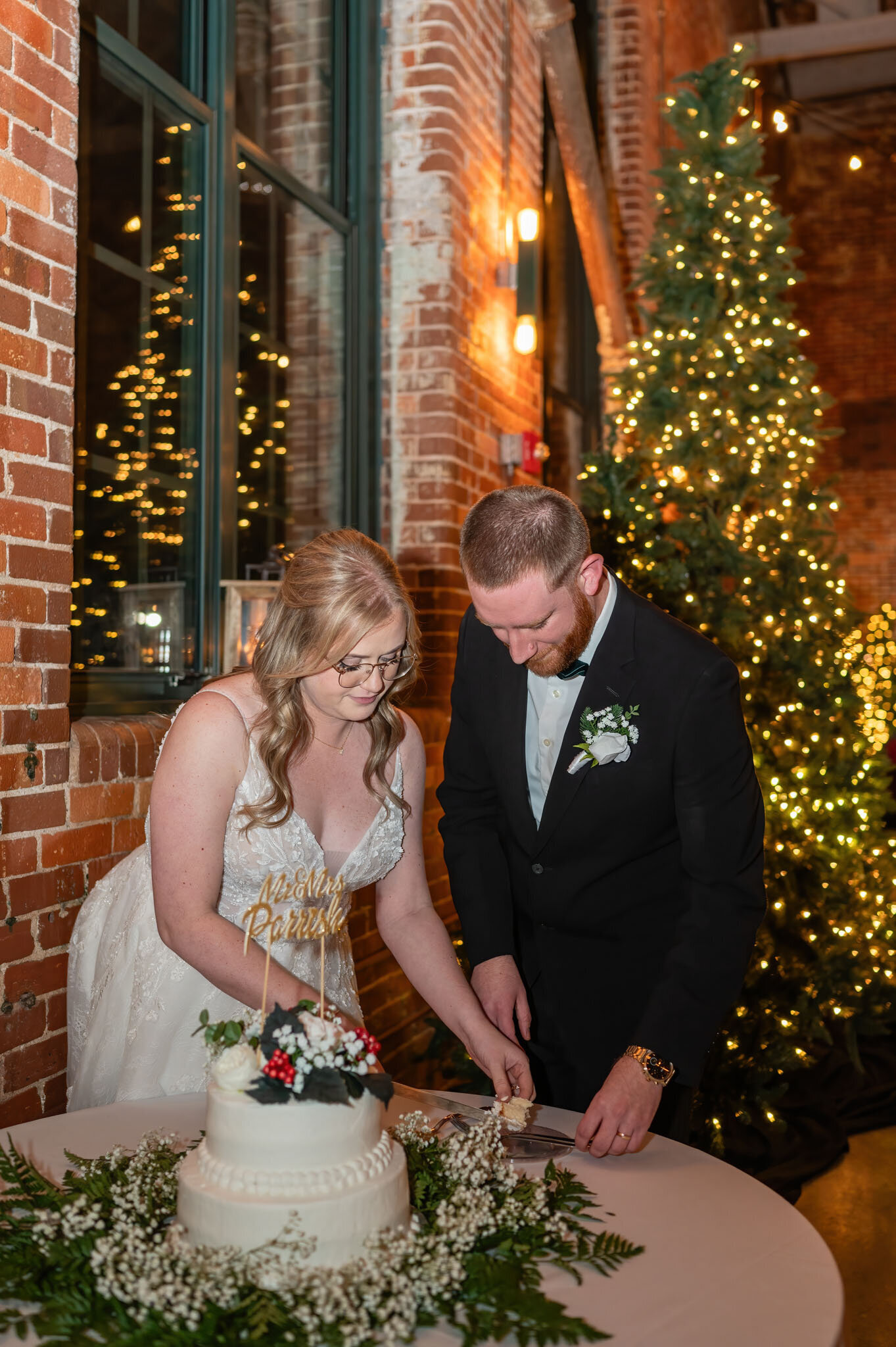bride and groom cutting their cake