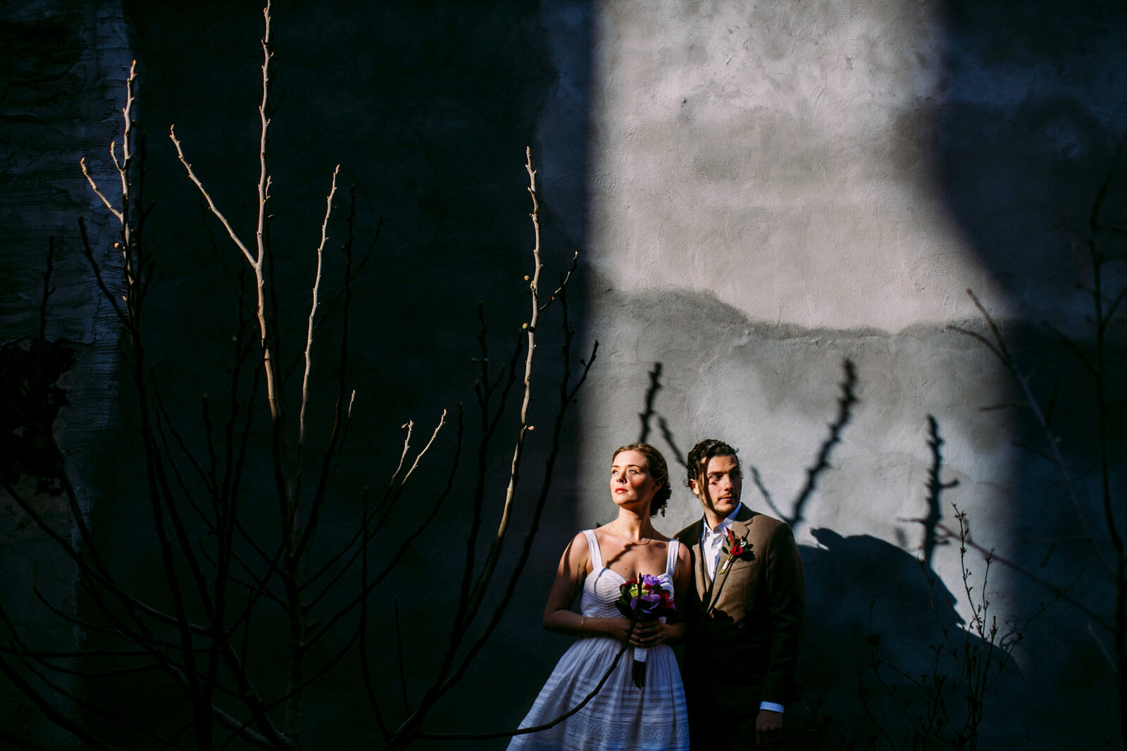 bride and groom maas building at sunset