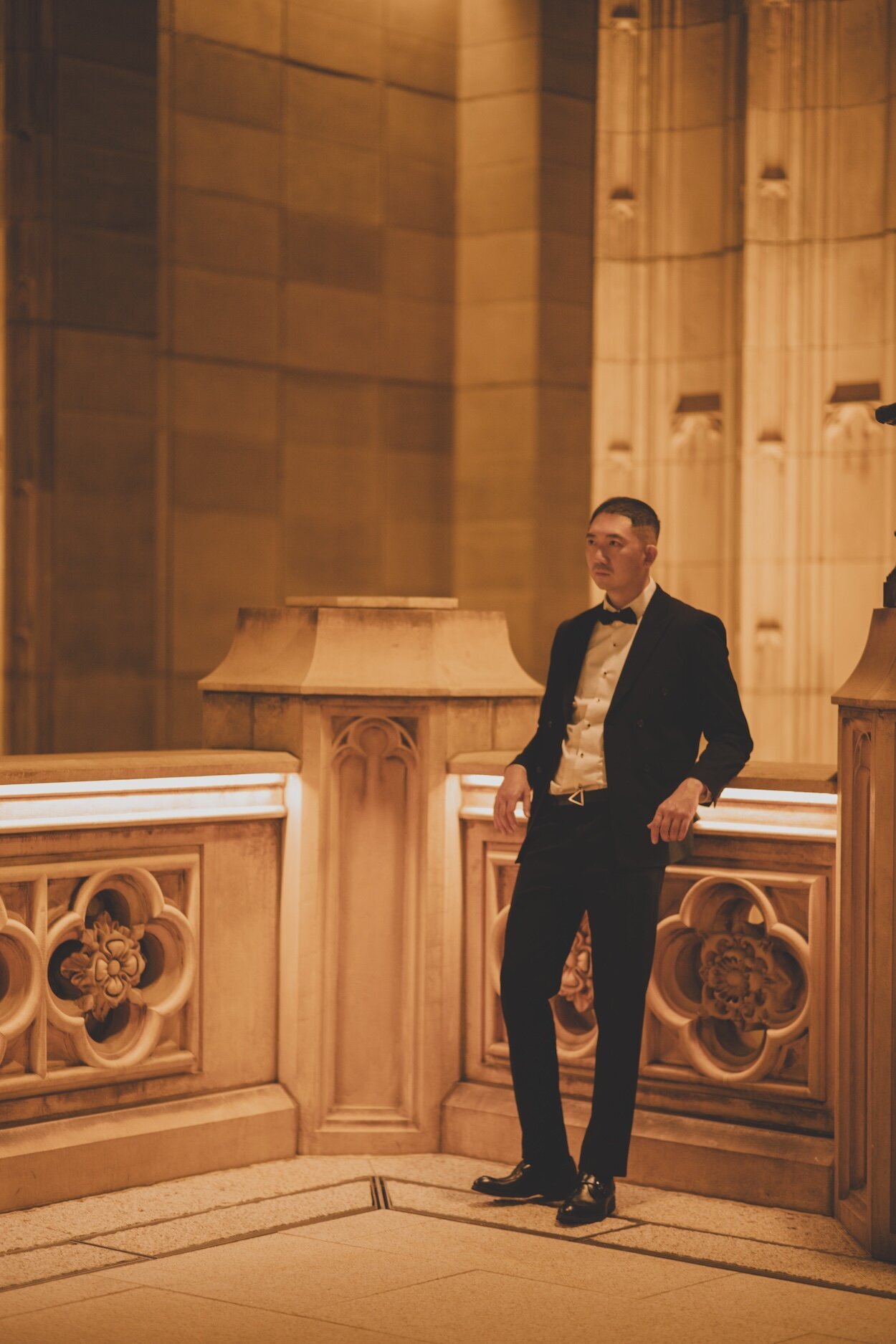 Prescott of 3N7LOVE photographed in a suit at night in Macau.