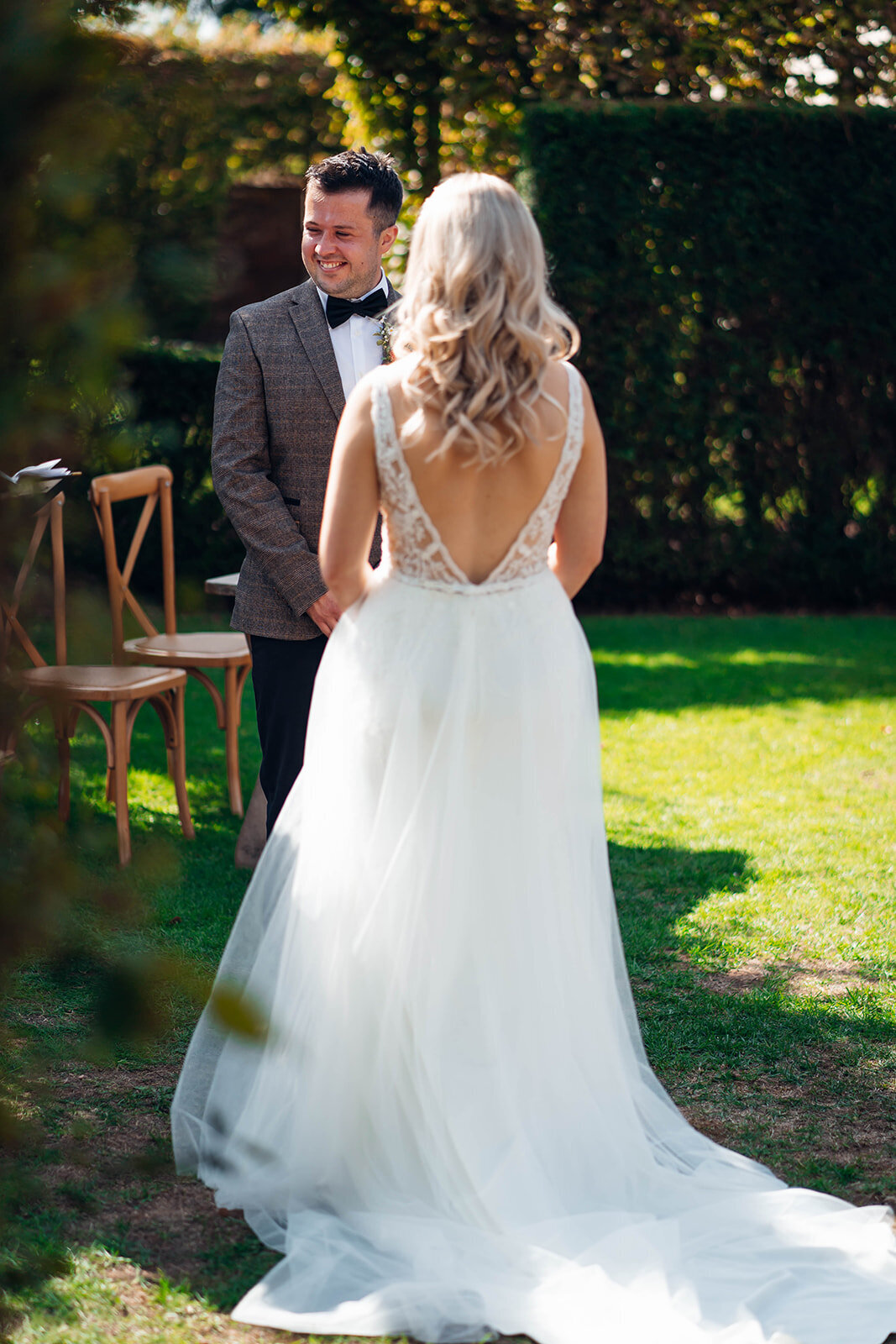 couple-exchanging-wedding-vows-during-outdoor-caswell-house-ceremony