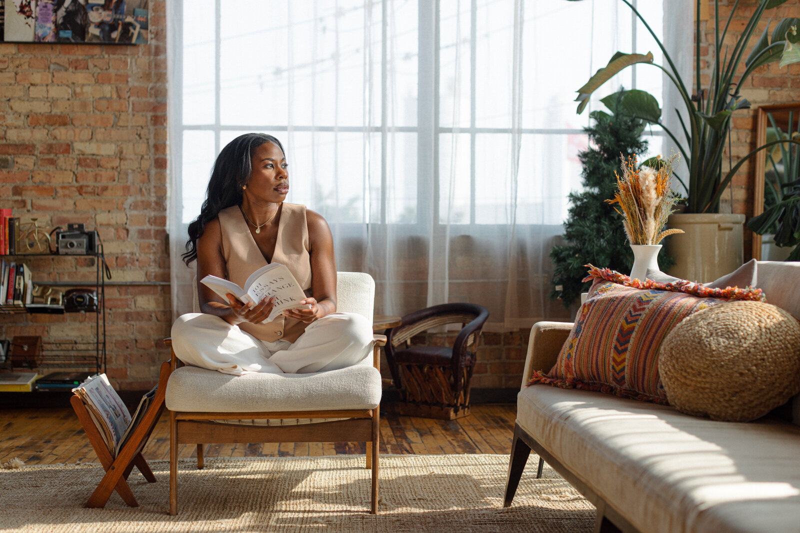 sex therapist Maia Easley sitting on white chair looking to the right