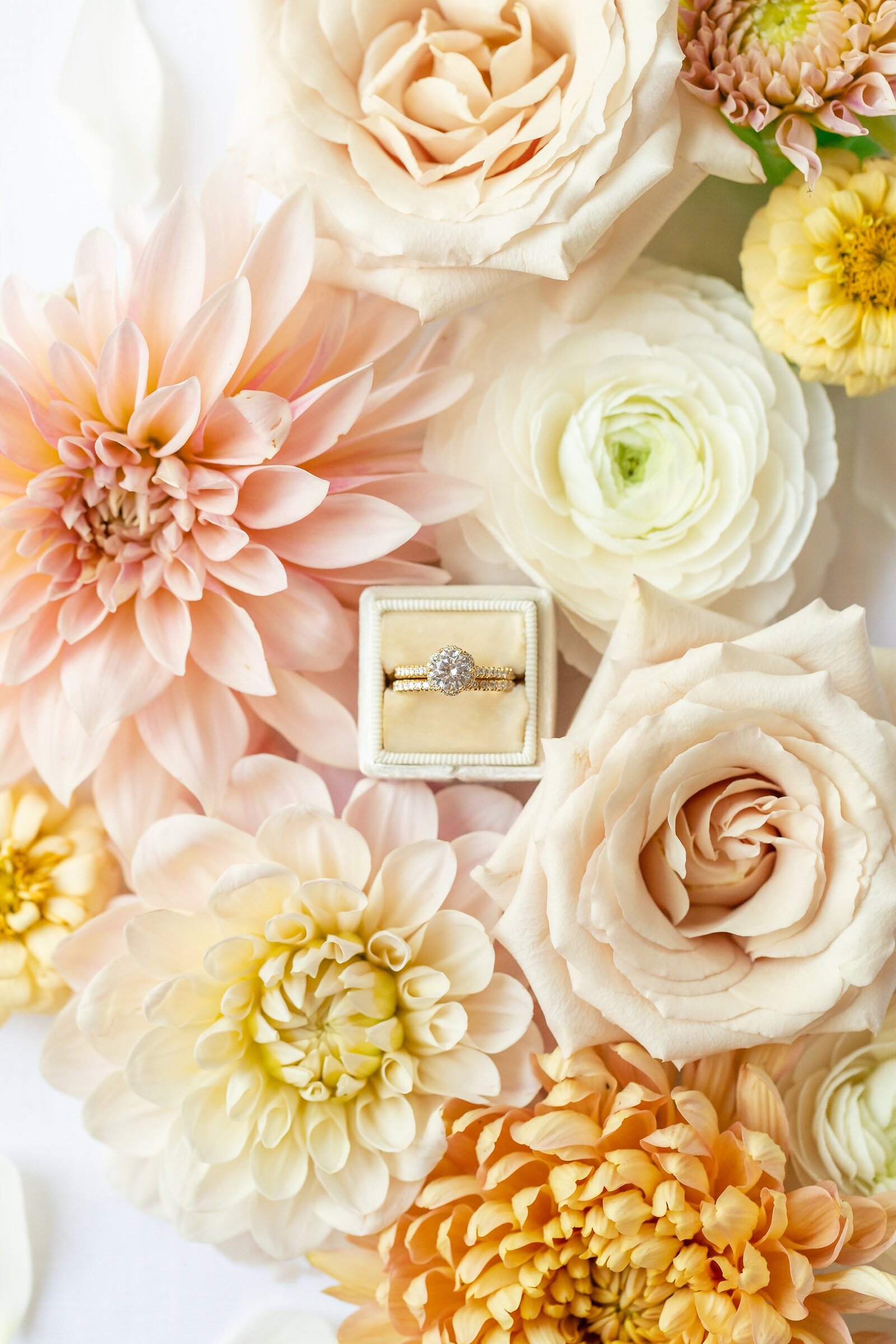 Wedding-ring-flatlay-with-lots-of-beautiful-colourful-soft-florals