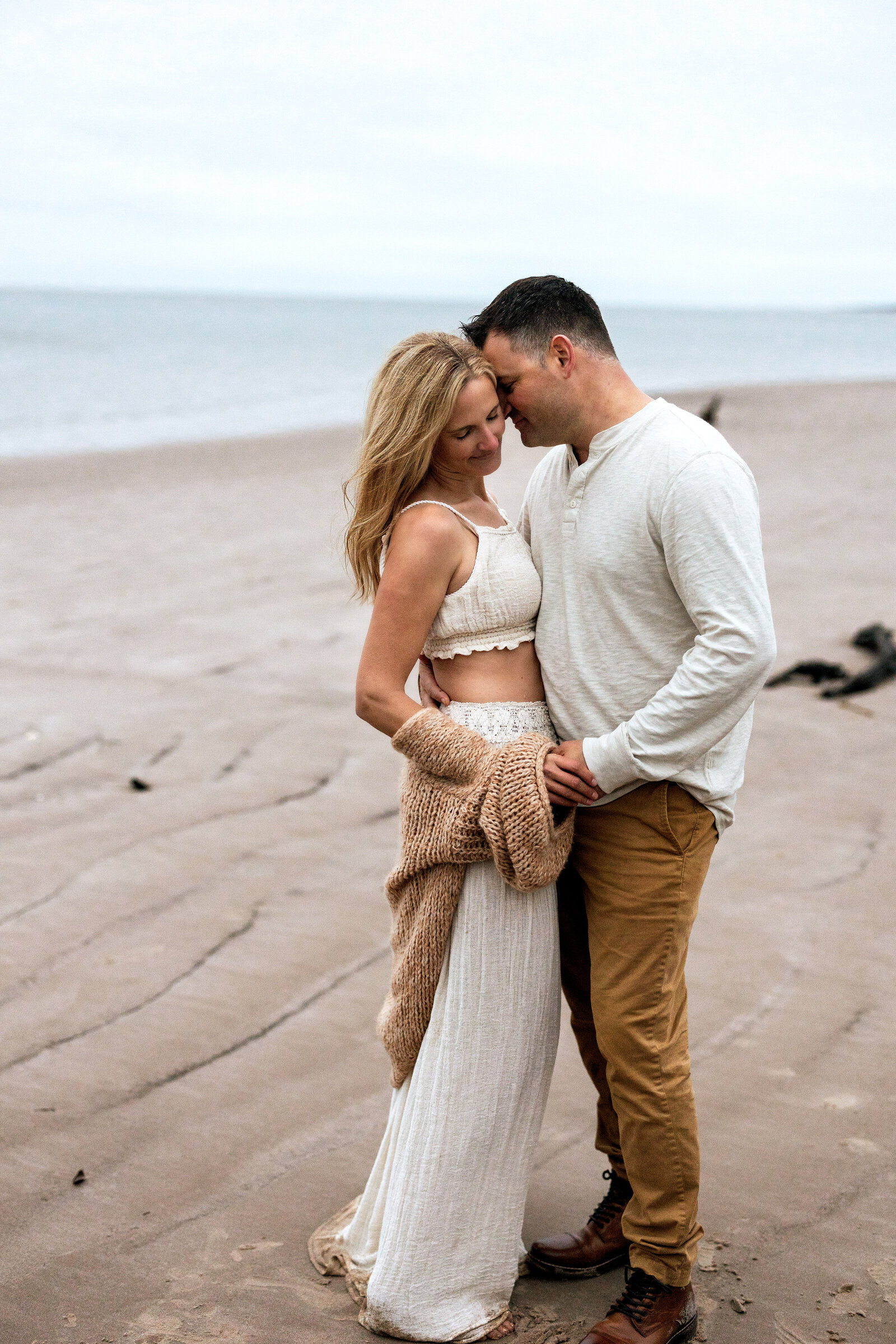 Husband and wife swaying together on the beach in Florida