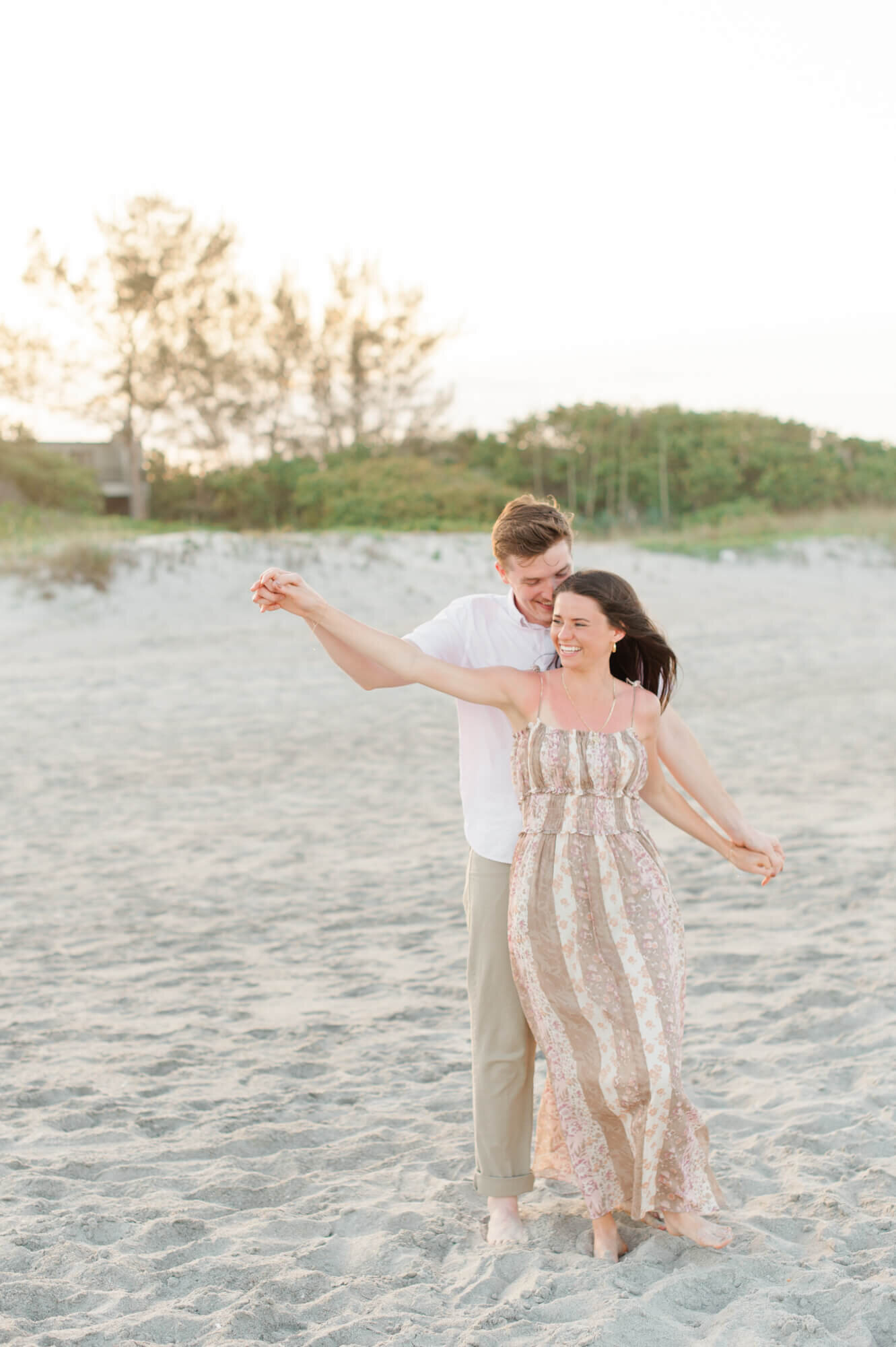 Orlando photographer captures beautiful couple dancing on the beach at sunset