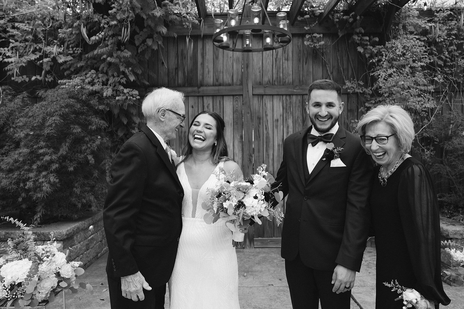 Authentic wedding day joy — bride and groom laugh with grandparents during heartfelt family portraits. Captured by Jordan Grover Photo, a Missouri-based traveling wedding photographer specializing in timeless, candid, and documentary wedding photography