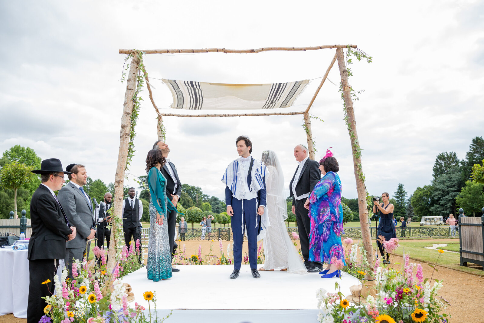 Bride and Groom standing under the chuppah