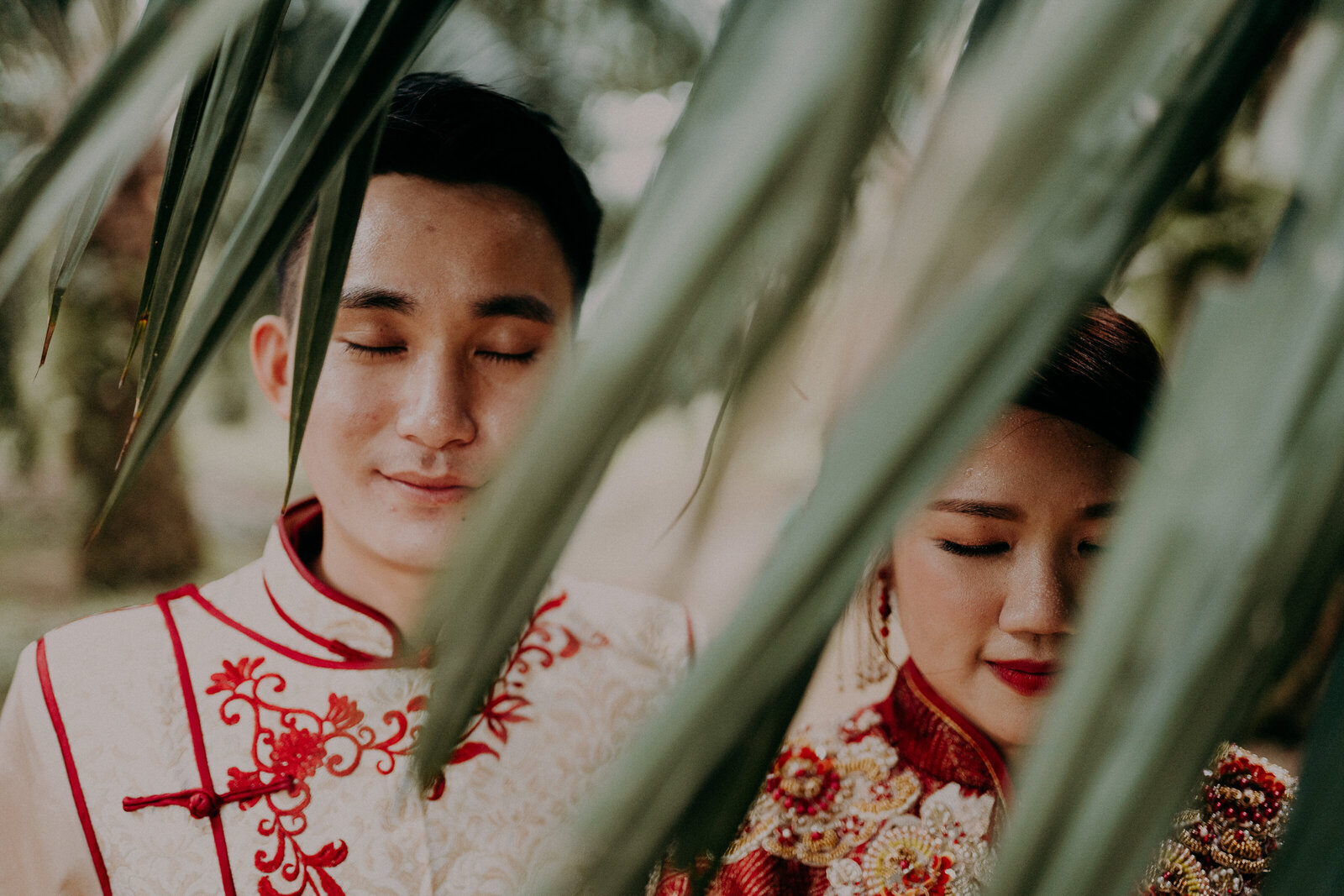 the couple in traditional chinese wedding costume