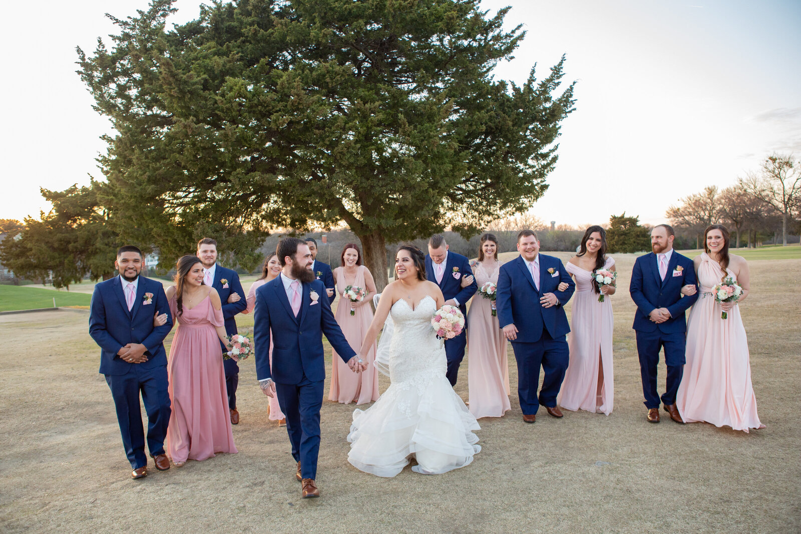 wedding party walking and laughing