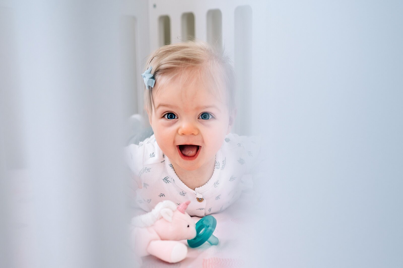Baby through crib McKennaPattersonPhotography
