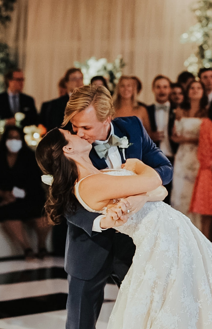 A bride and groom sharing their first dance at a Texas wedding reception.