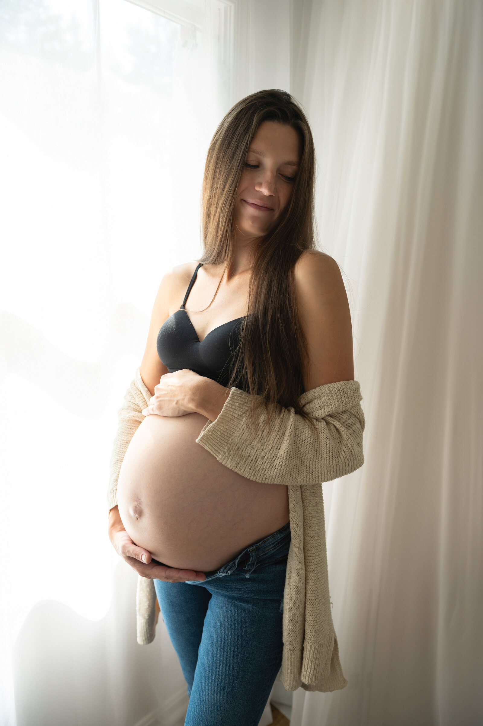 Baltimore maternity studio  with woman in her sweater