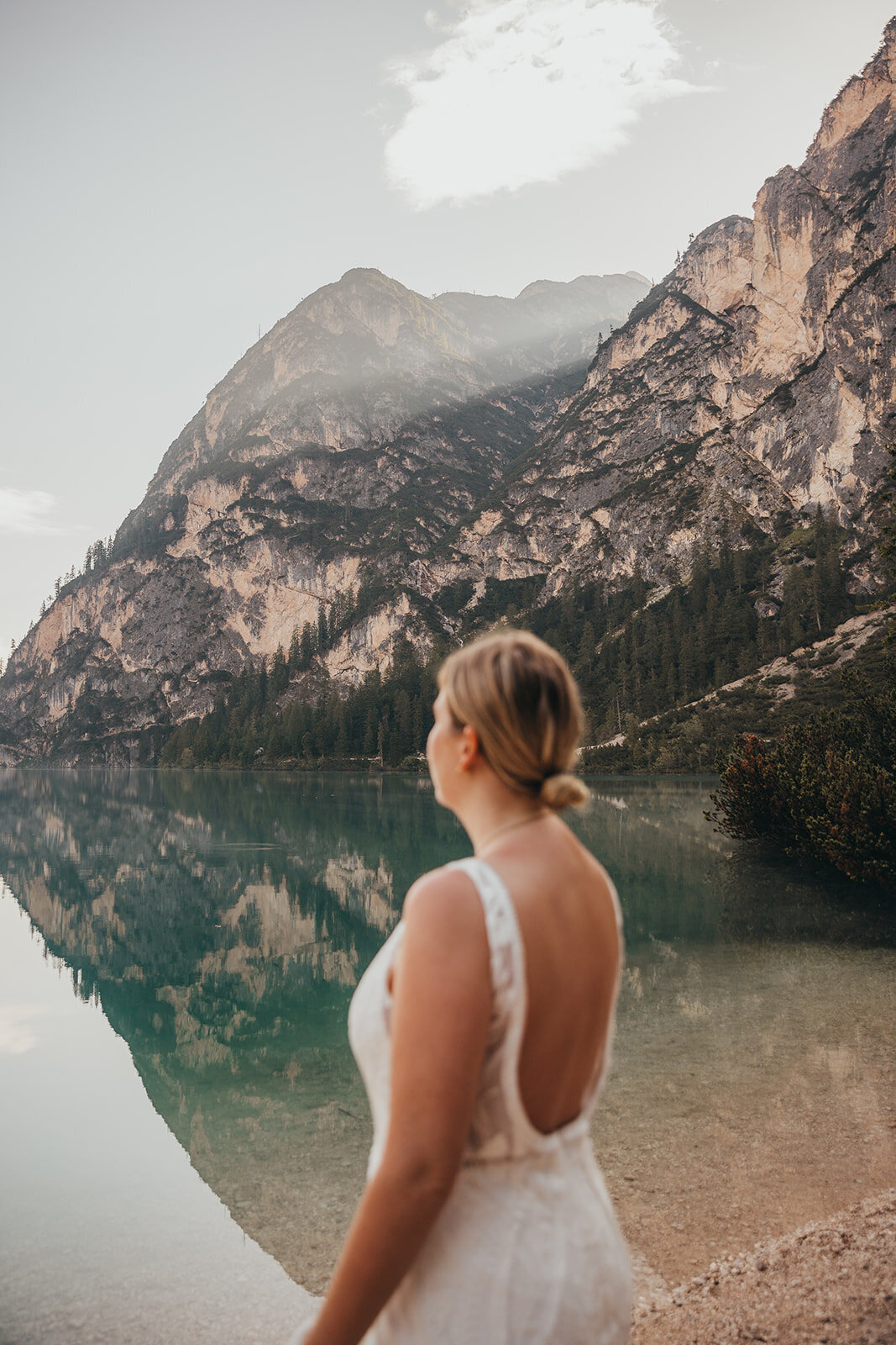 bride looks out to a lake