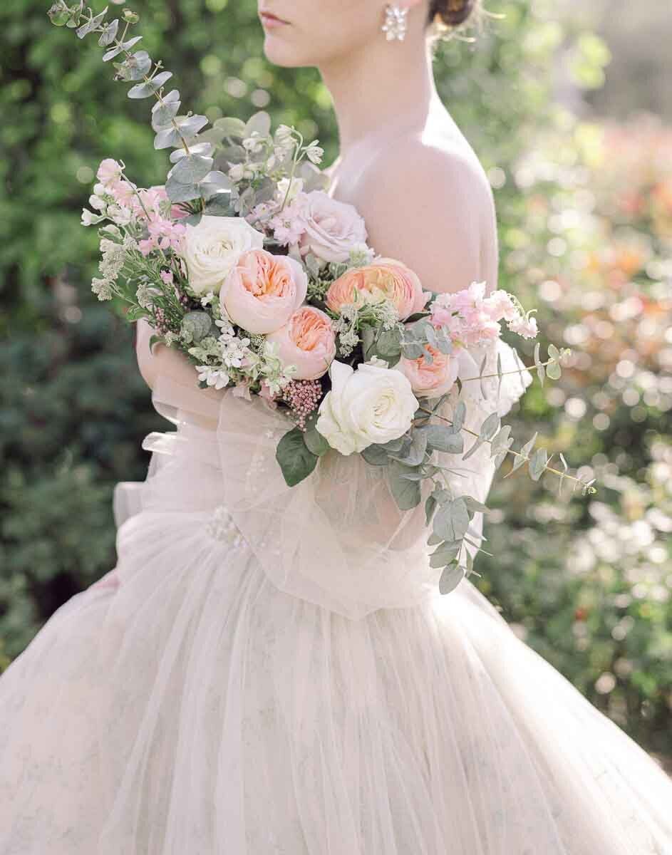 elegant bridal portrait of woman holding bouquet