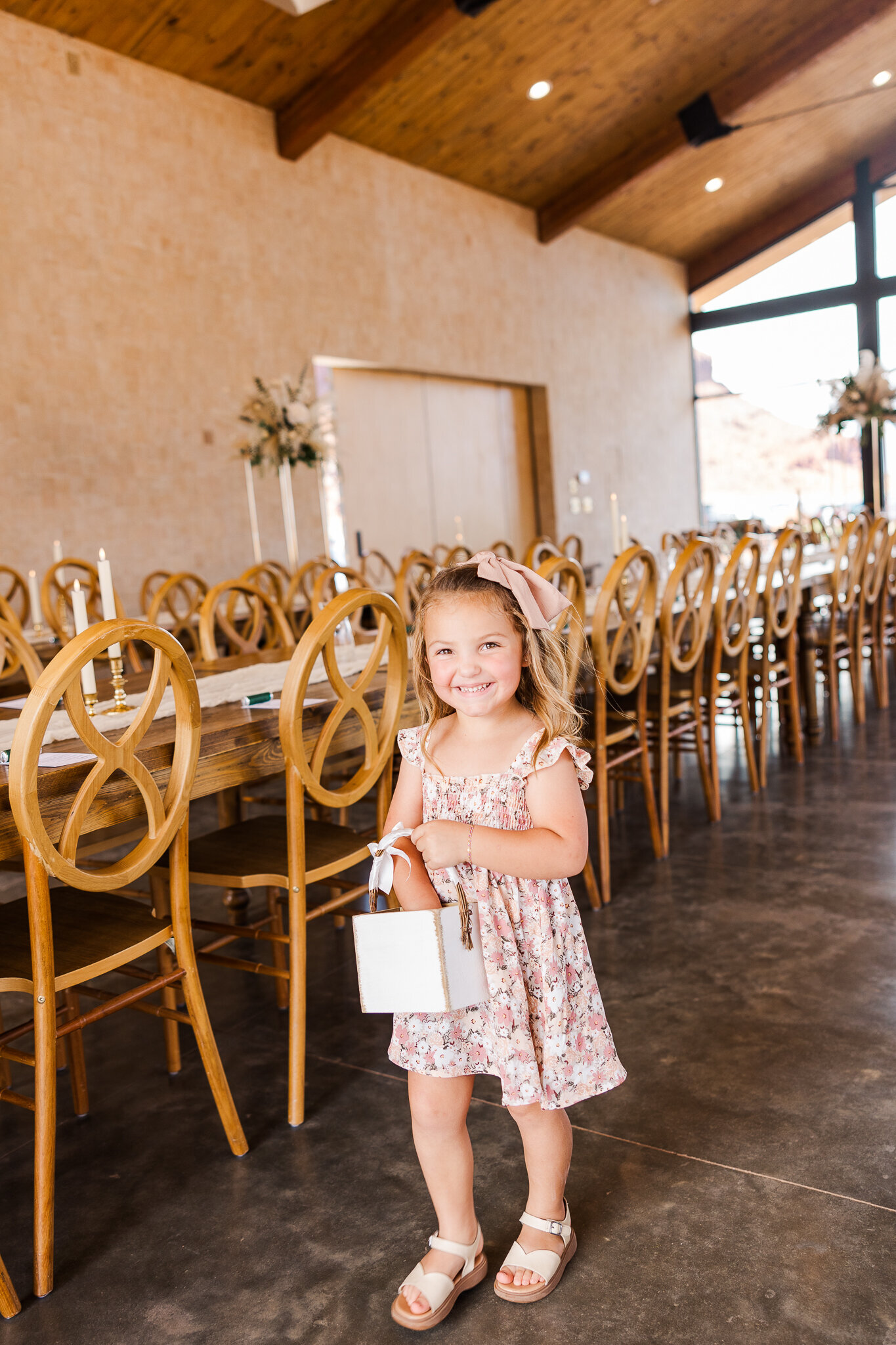 Flower girl getting ready to  walk down aisle at the Red Earth Venue 