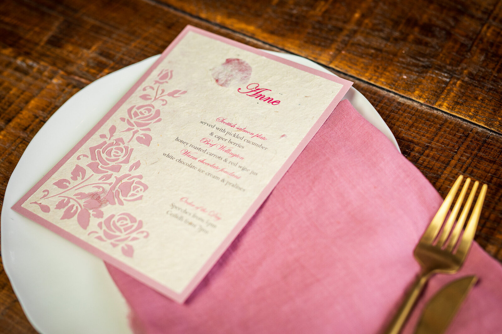 Wedding place card on sustainable lokta paper with embedded rose petals