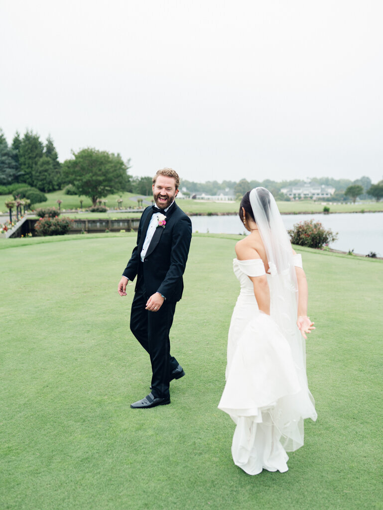 groom laughing with his bride taken by baltimore wedding photographer Nicole Simensky